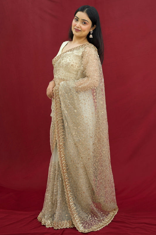 Golden sequins embellished net saree