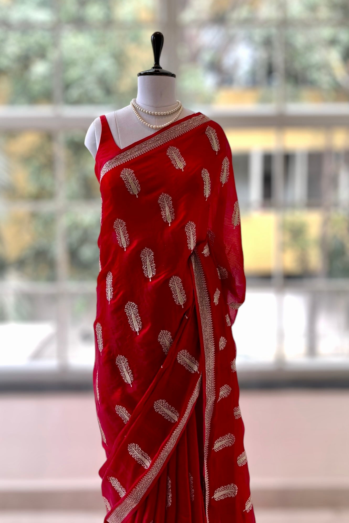 Red embroidered chiffon saree