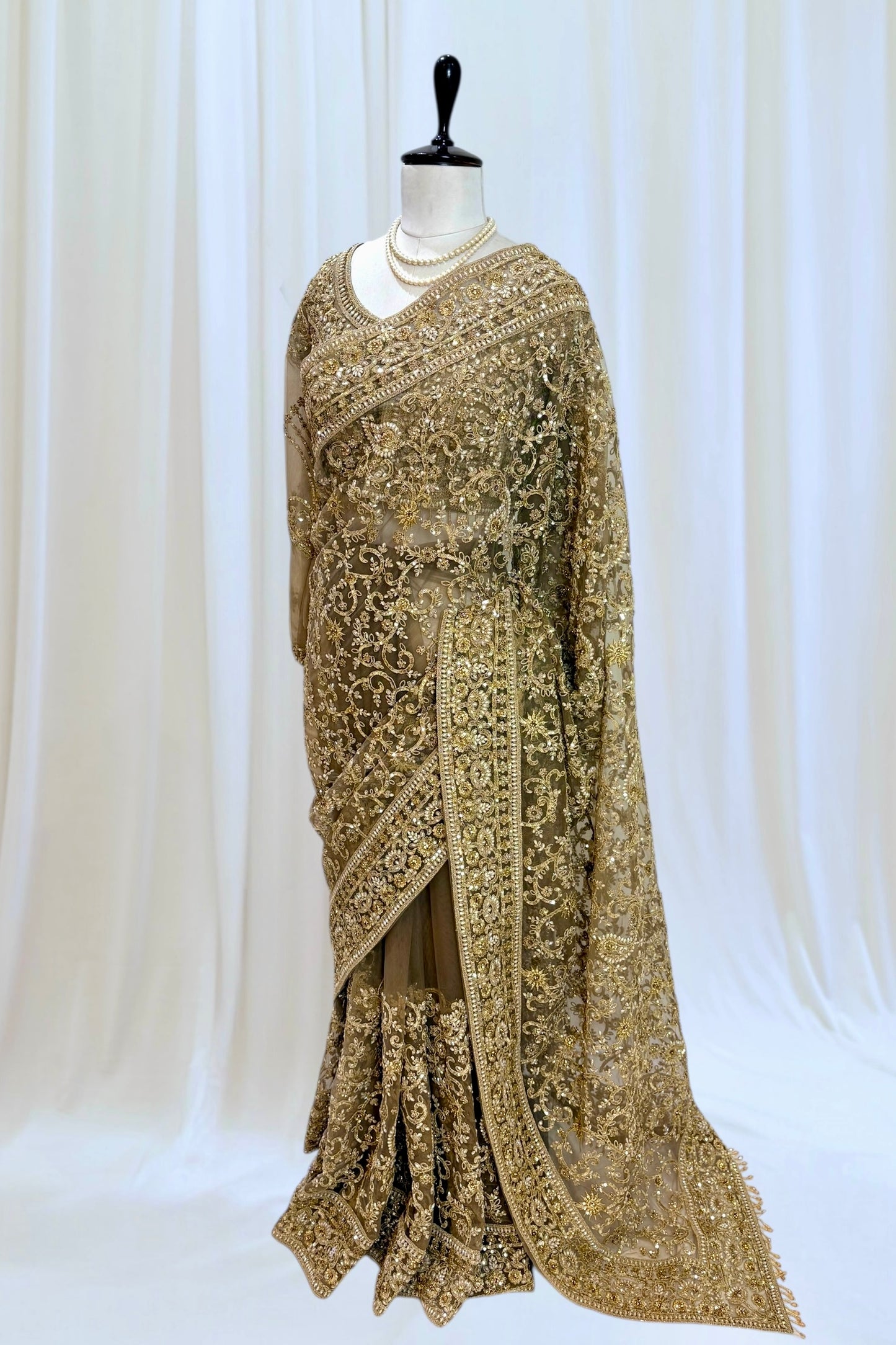 Golden embellished net saree