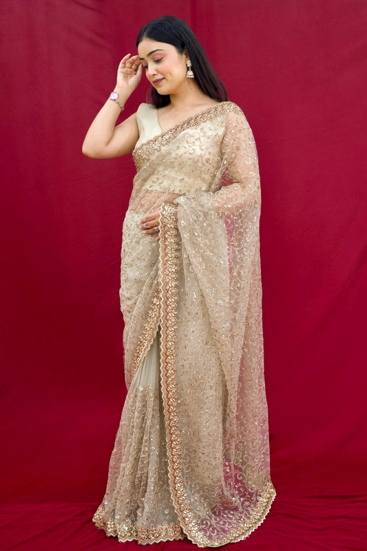 Golden sequins embellished net saree