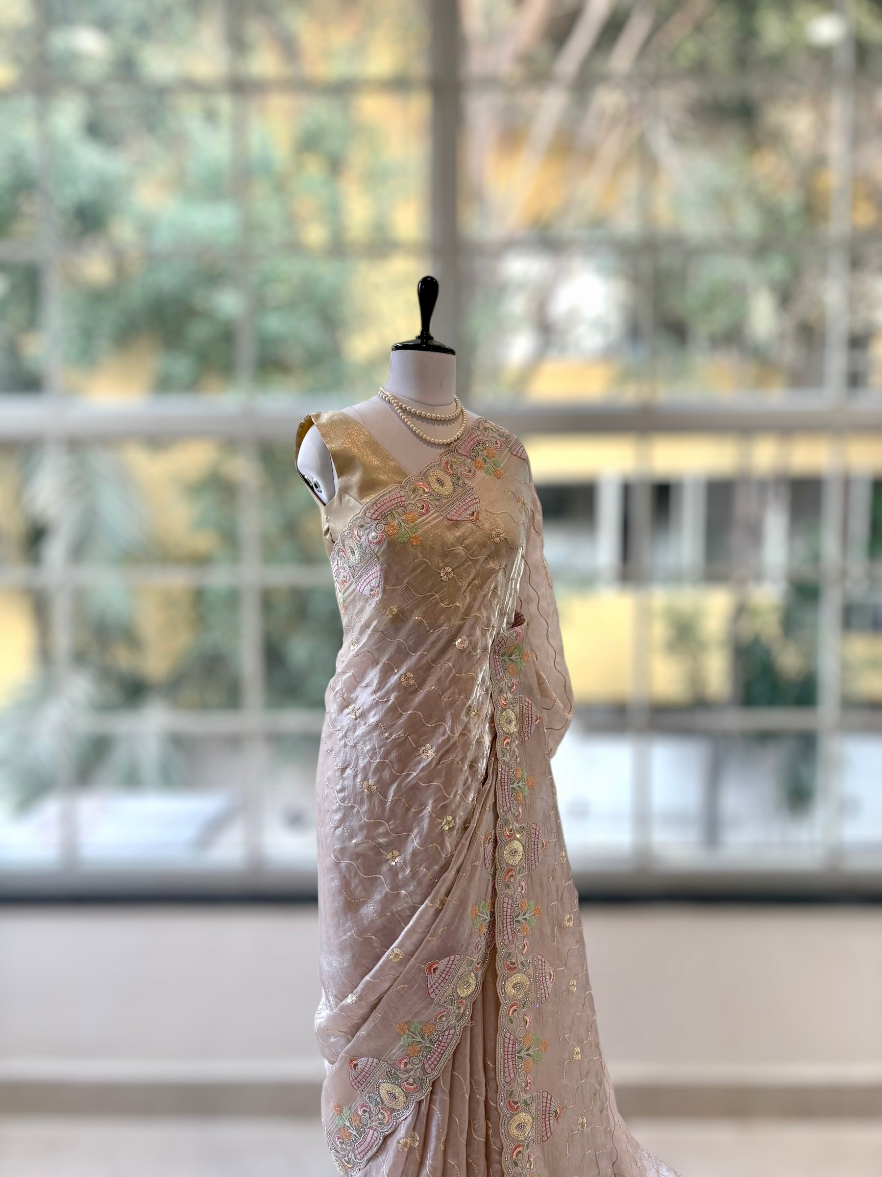 Nude fendy satin embellished saree