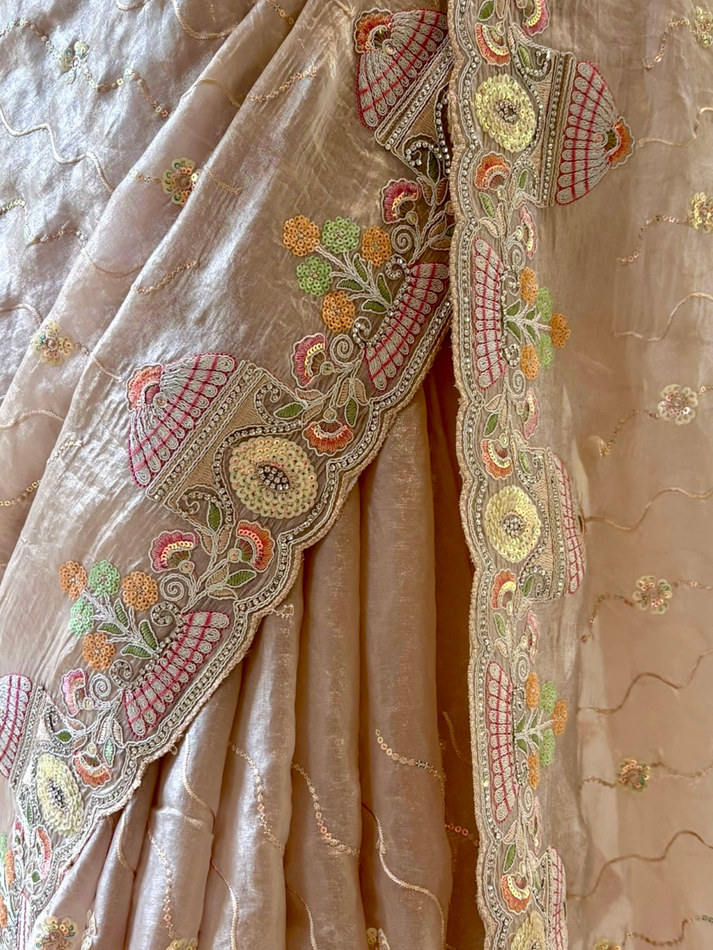 Nude fendy satin embellished saree