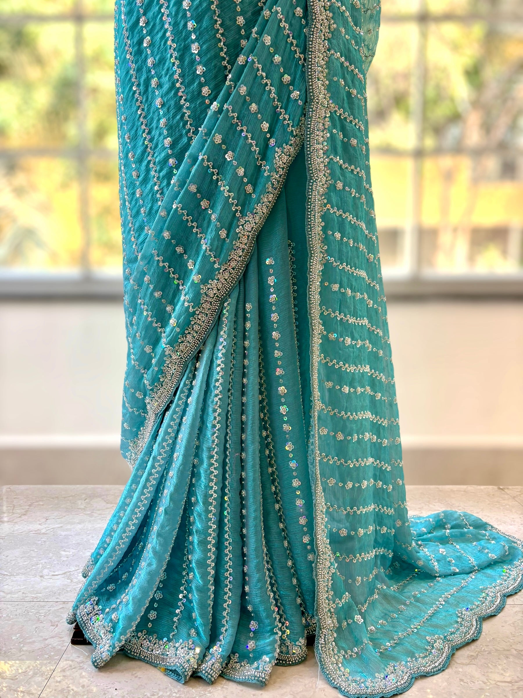Powder blue shimmer chiffon embellished saree