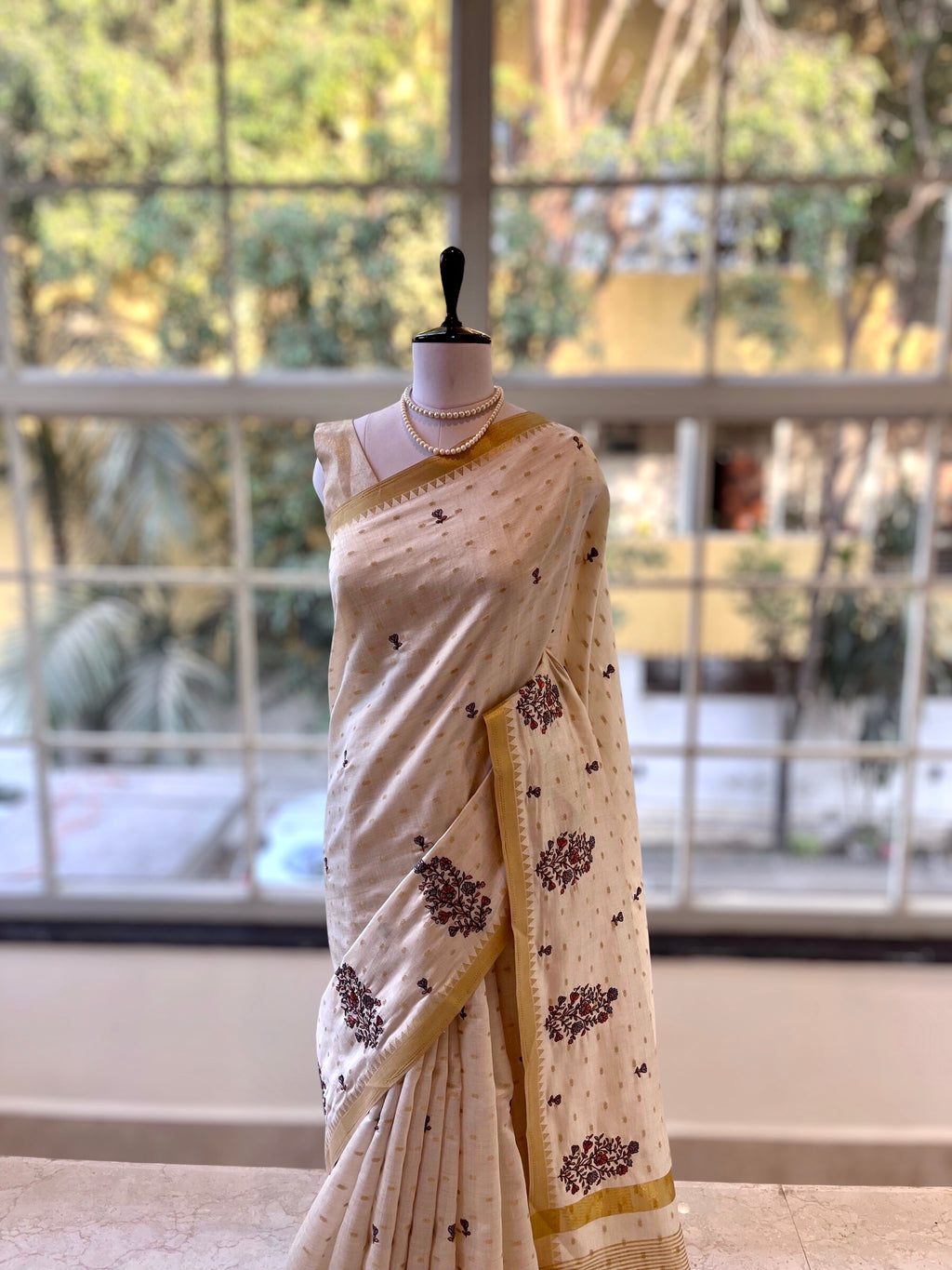 Beige Embroidered zari saree