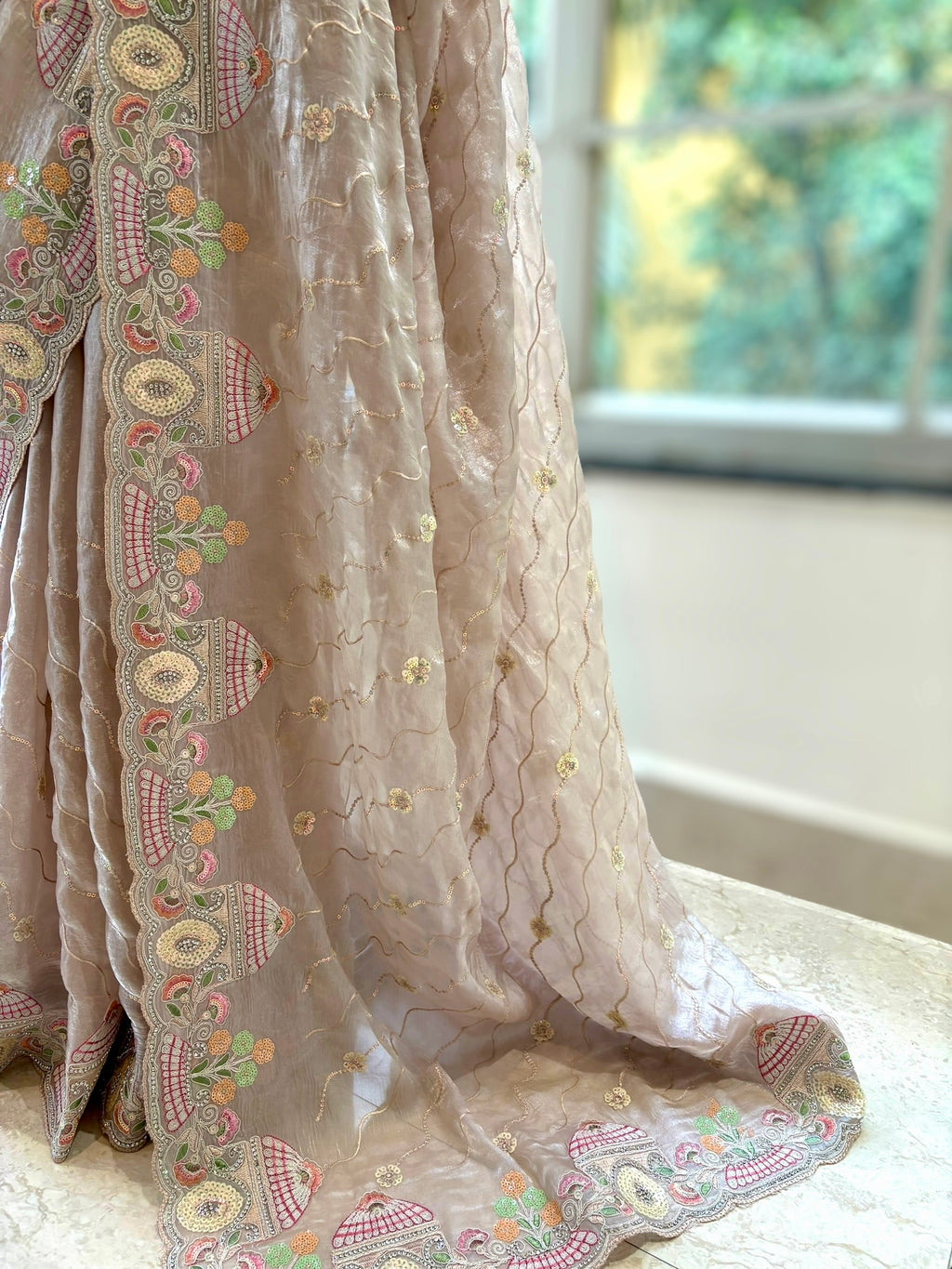 Nude fendy satin embellished saree