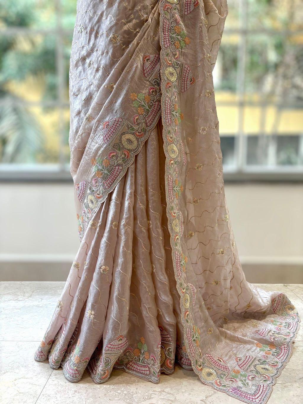 Nude fendy satin embellished saree