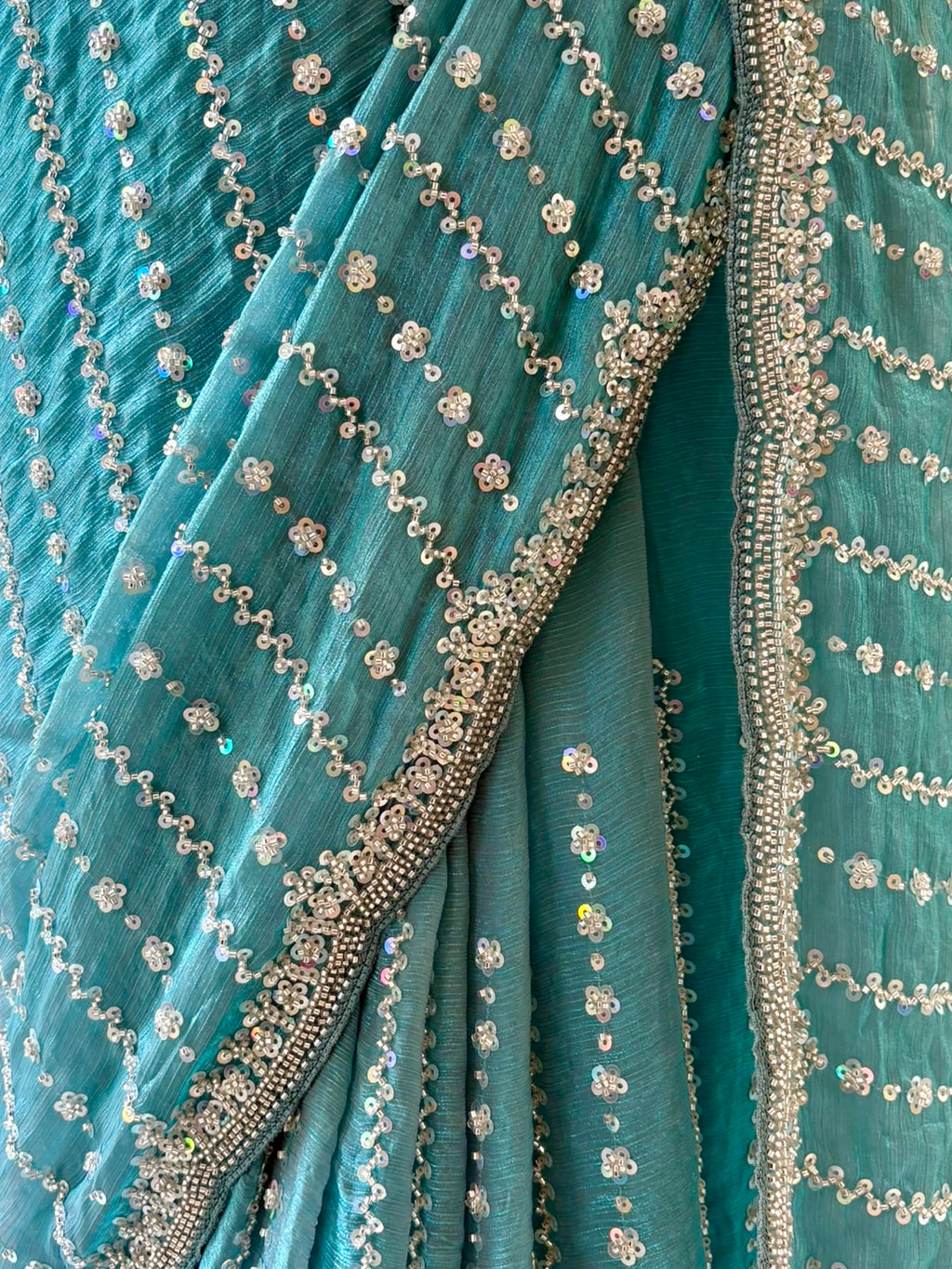 Powder blue shimmer chiffon embellished saree