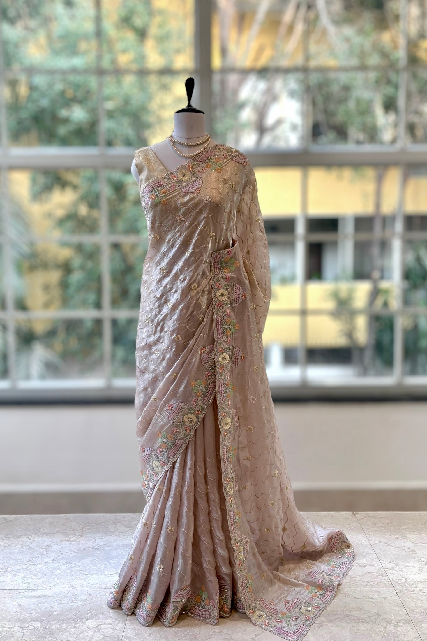 Nude fendy satin embellished saree