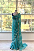 Powder blue shimmer chiffon embellished saree