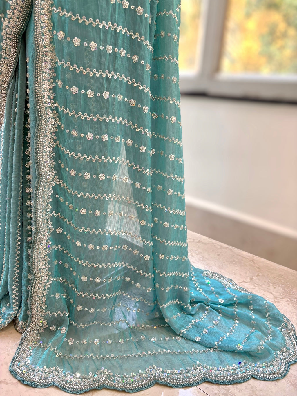 Powder blue shimmer chiffon embellished saree