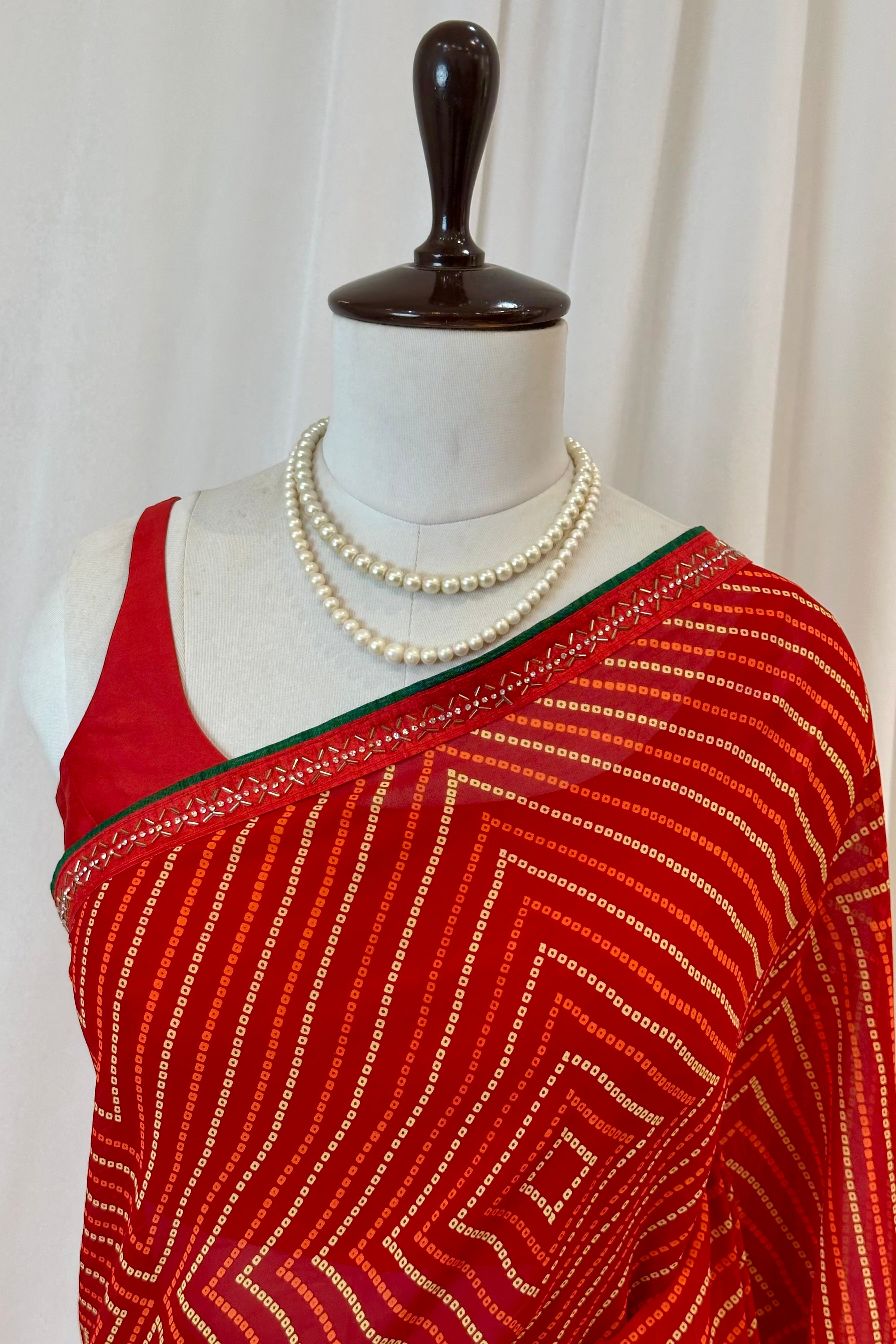 Red bandhani print georgette swarovski saree