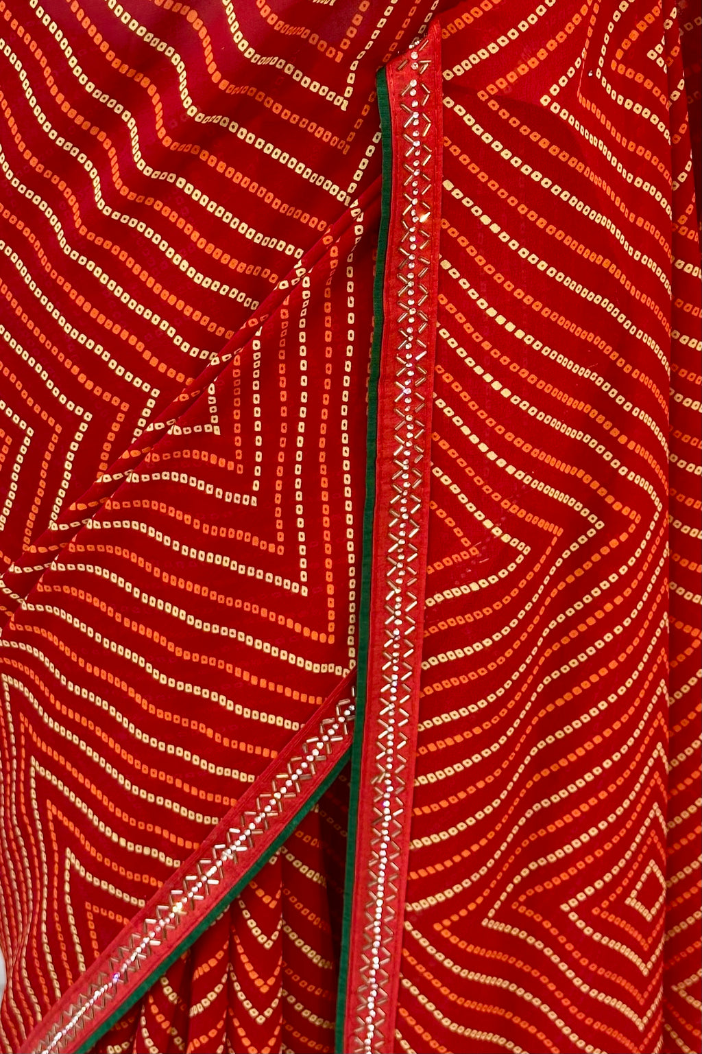 Red bandhani print georgette swarovski saree