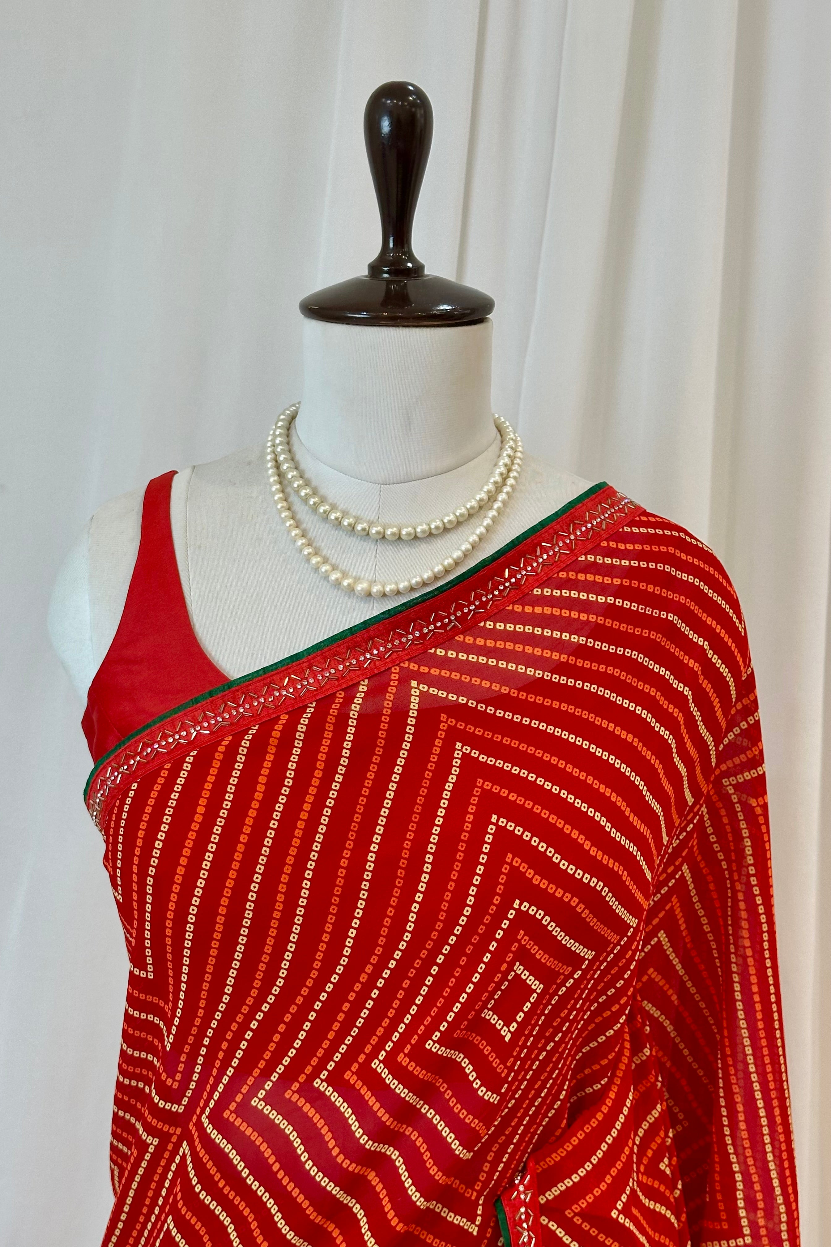 Red bandhani print georgette swarovski saree