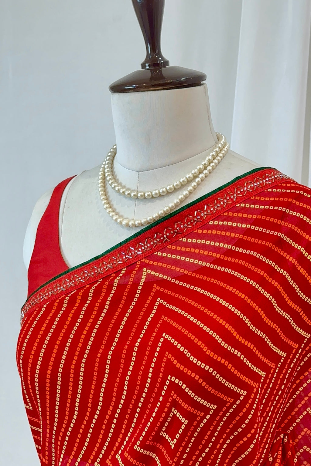 Red bandhani print georgette swarovski saree