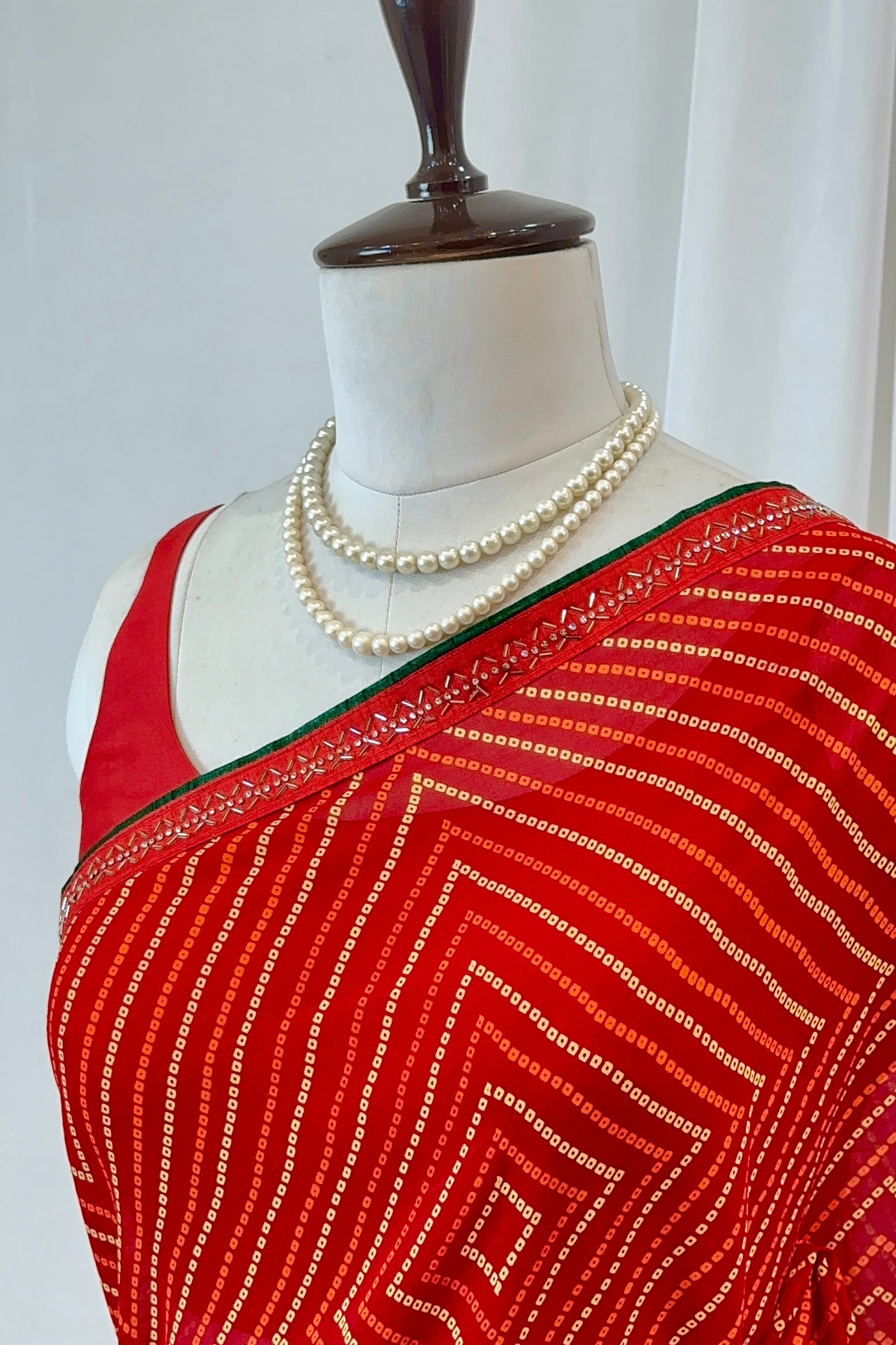 Red bandhani print georgette swarovski saree