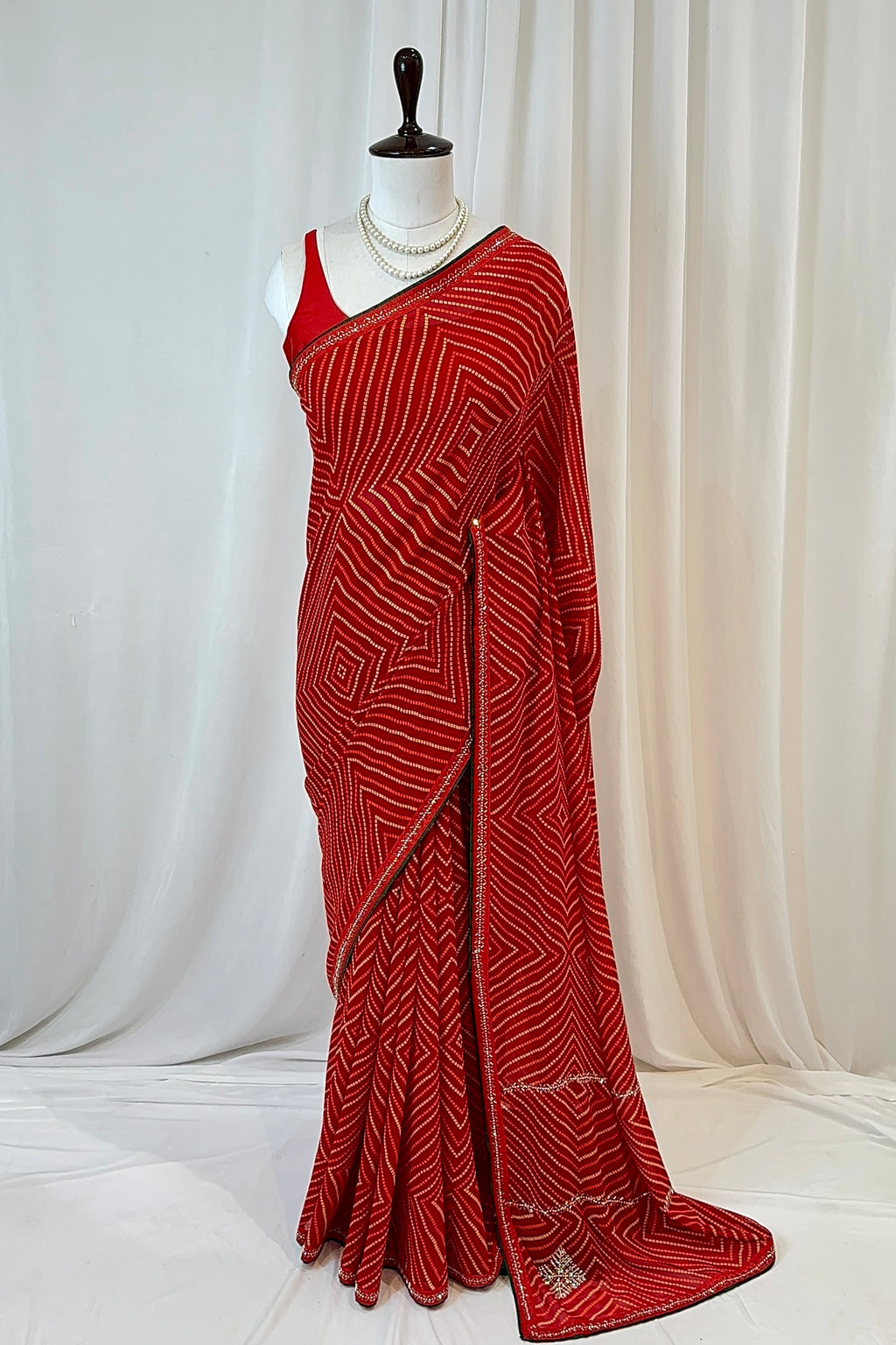 Red bandhani print georgette swarovski saree