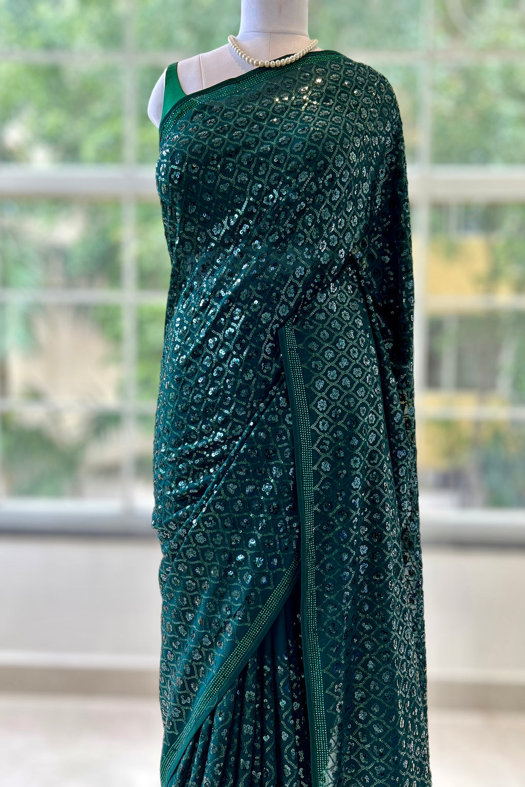 Bottle green georgette sequins saree