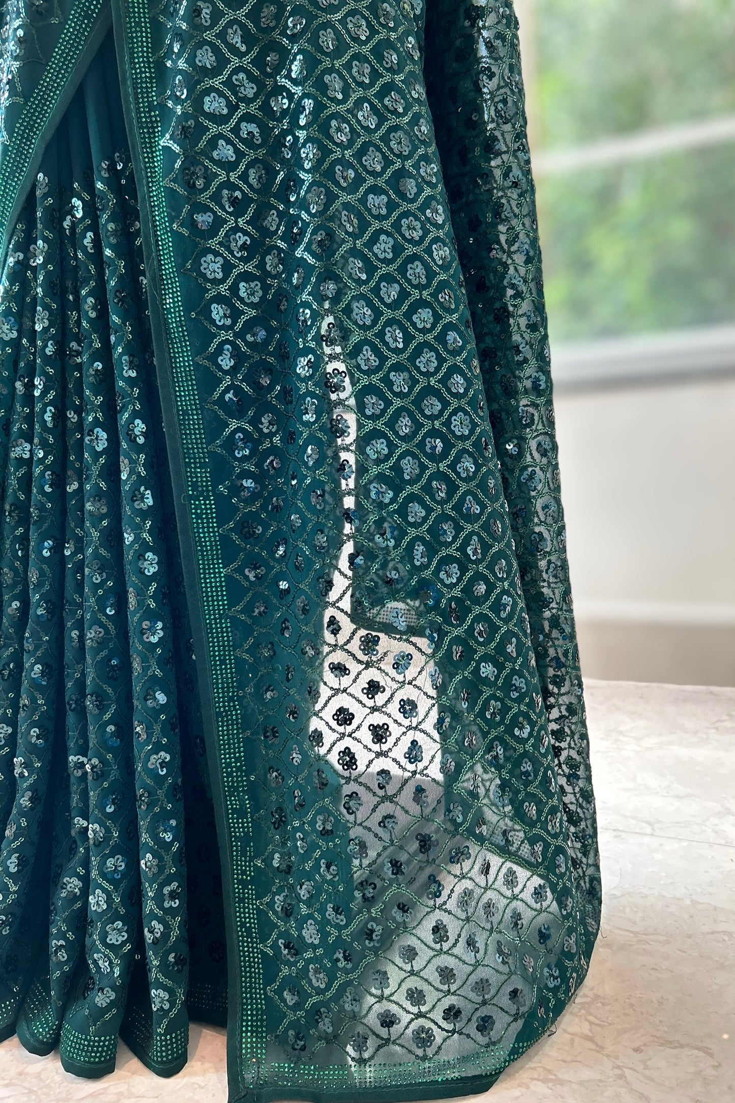 Bottle green georgette sequins saree