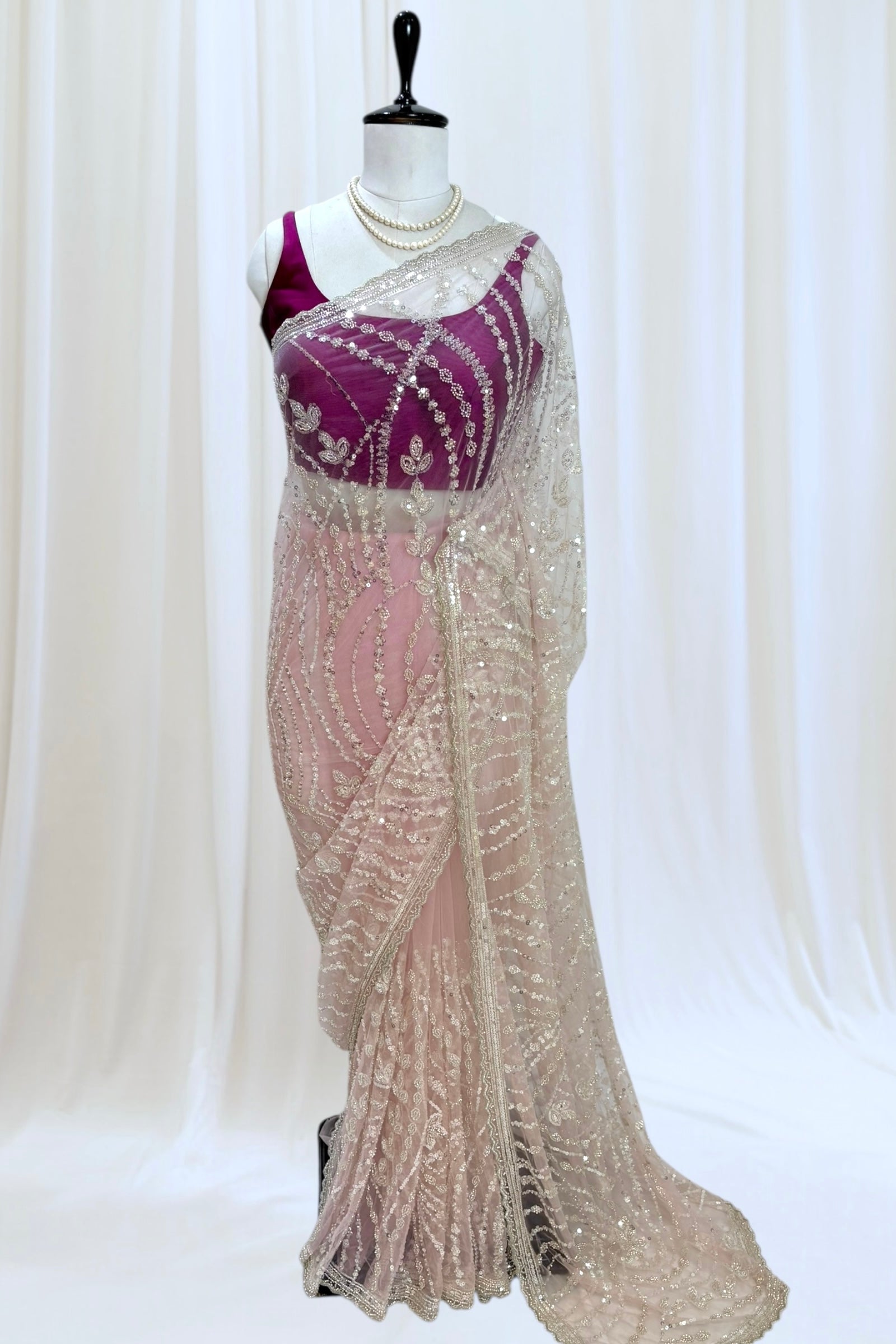 Pink sequins embellished net saree