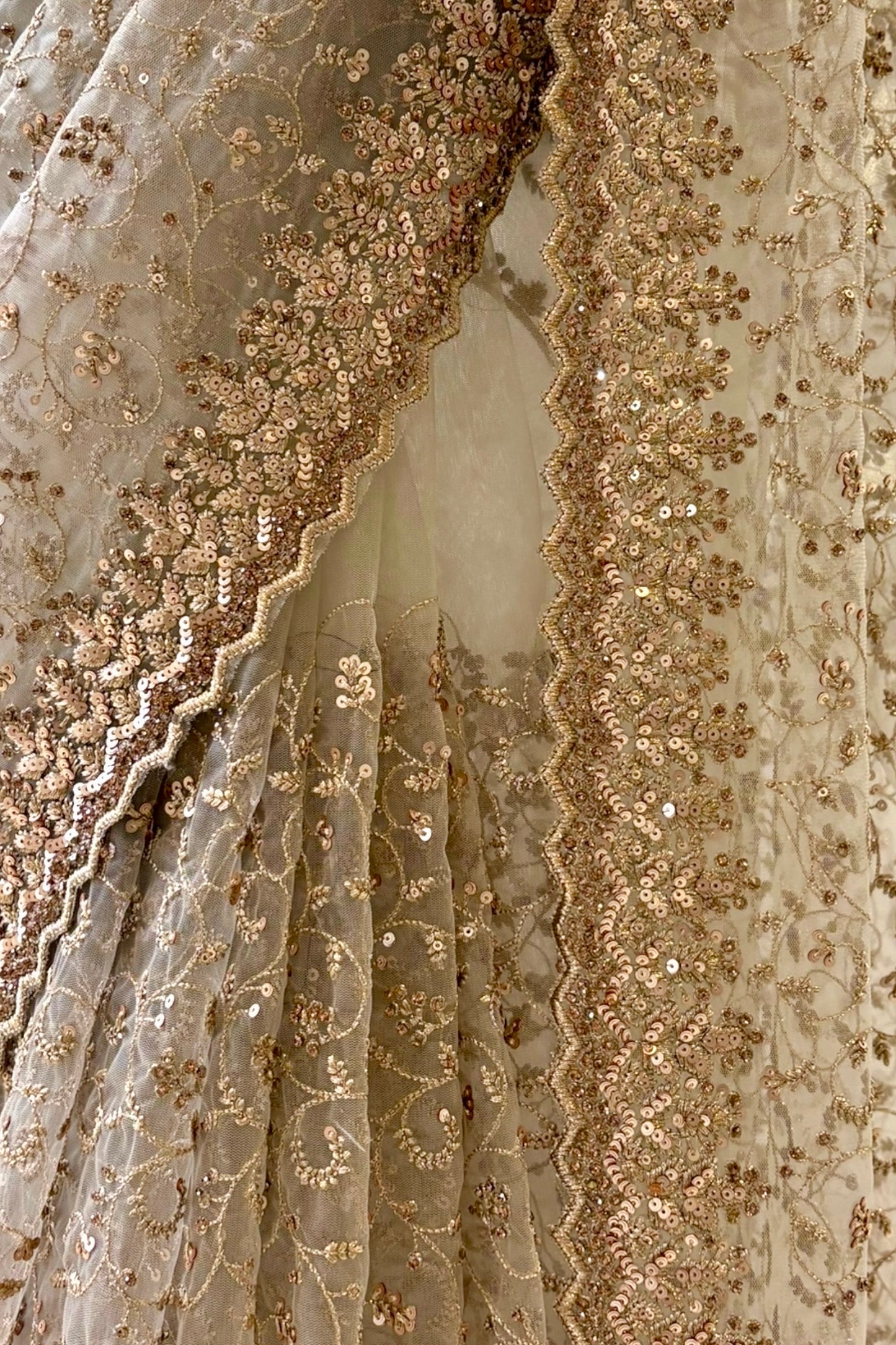 Golden sequins embellished net saree