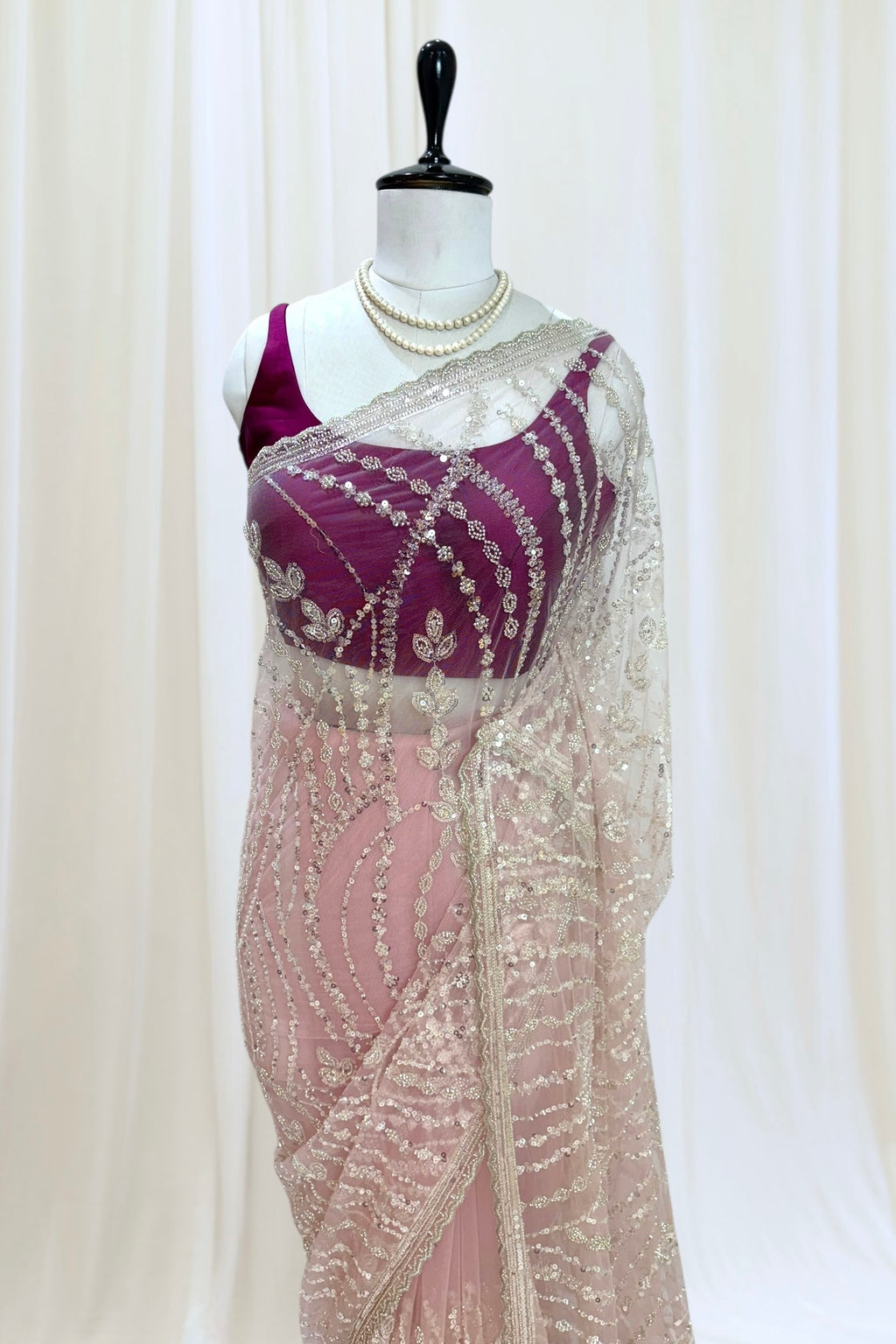 Pink sequins embellished net saree