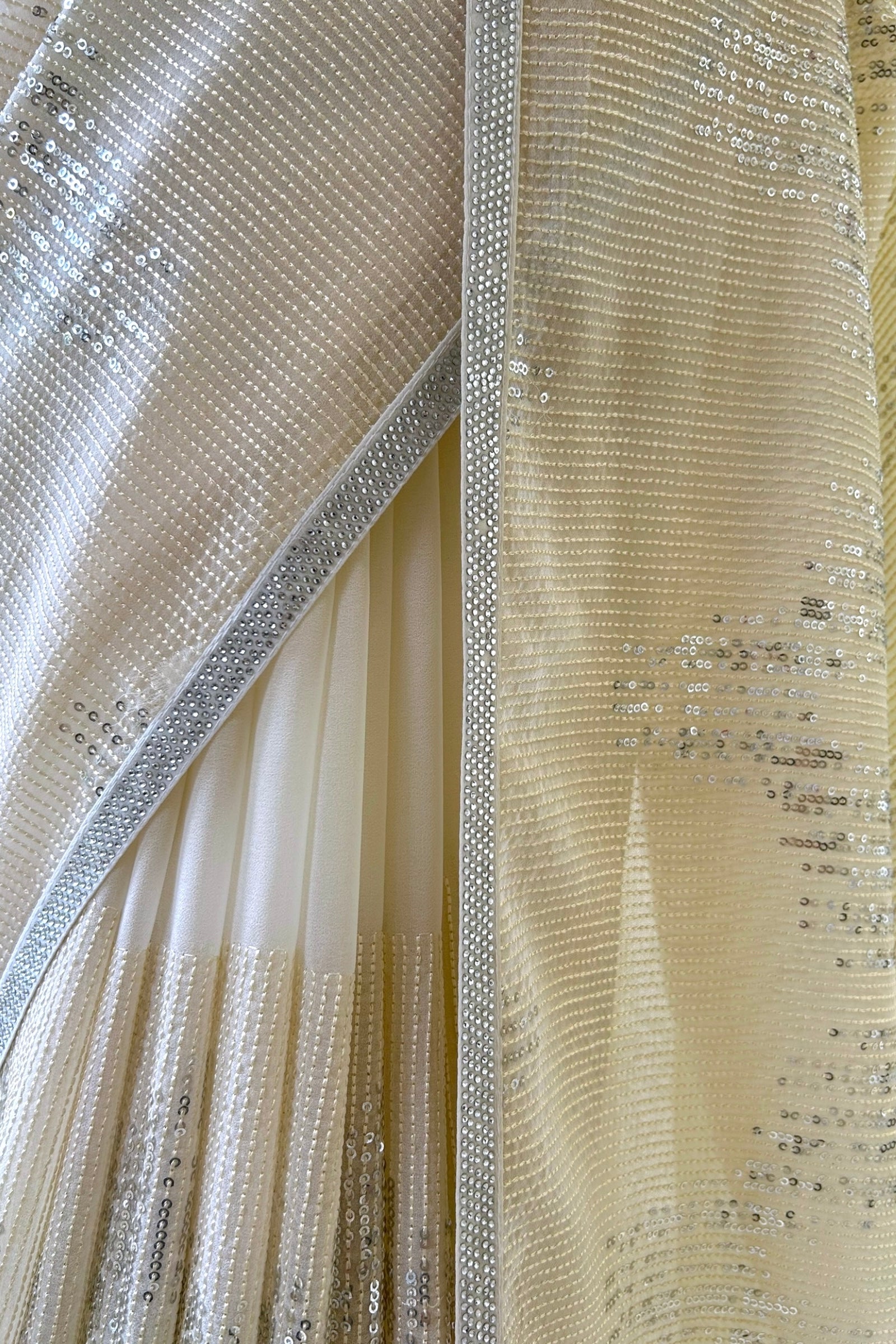 Off white sequins threadwork georgette saree