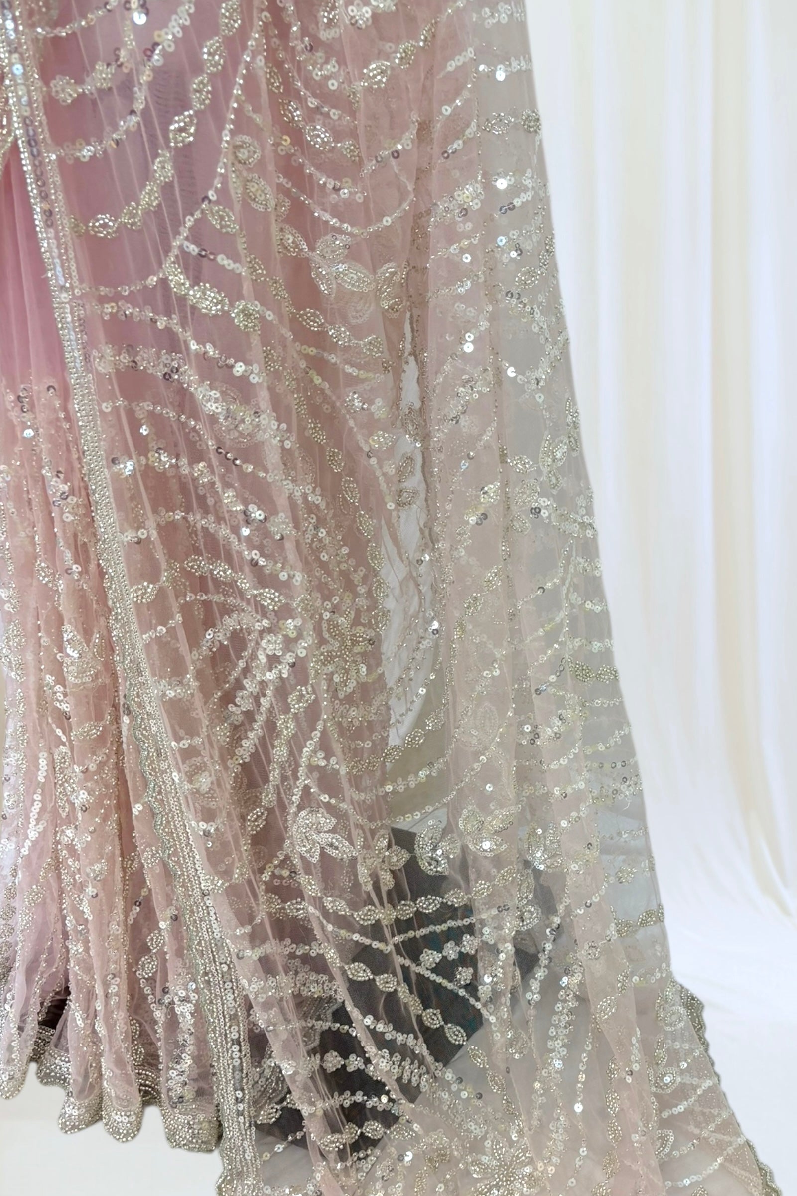 Pink sequins embellished net saree