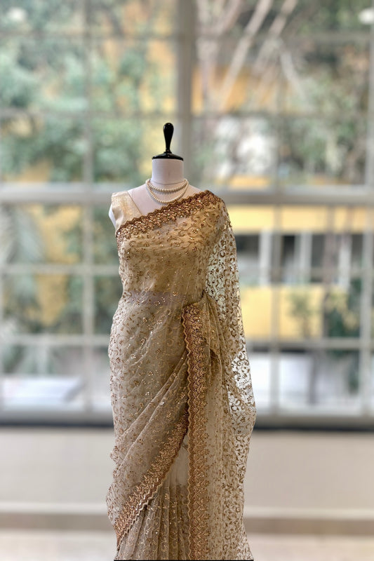 Golden sequins embellished net saree