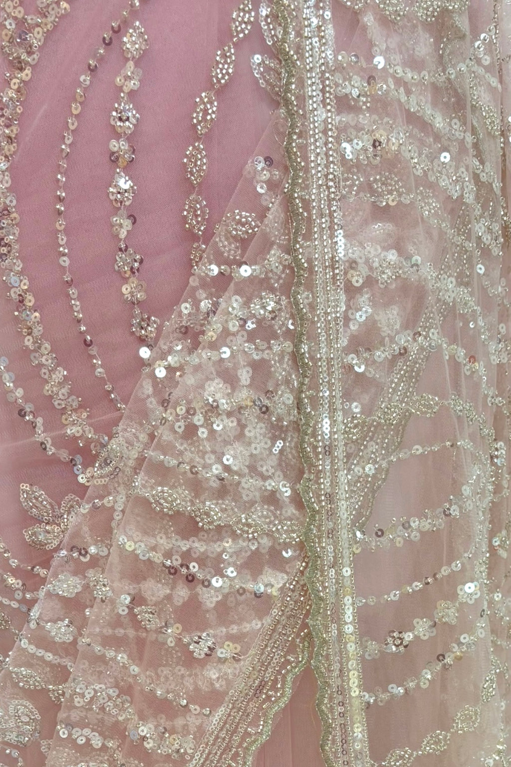 Pink sequins embellished net saree