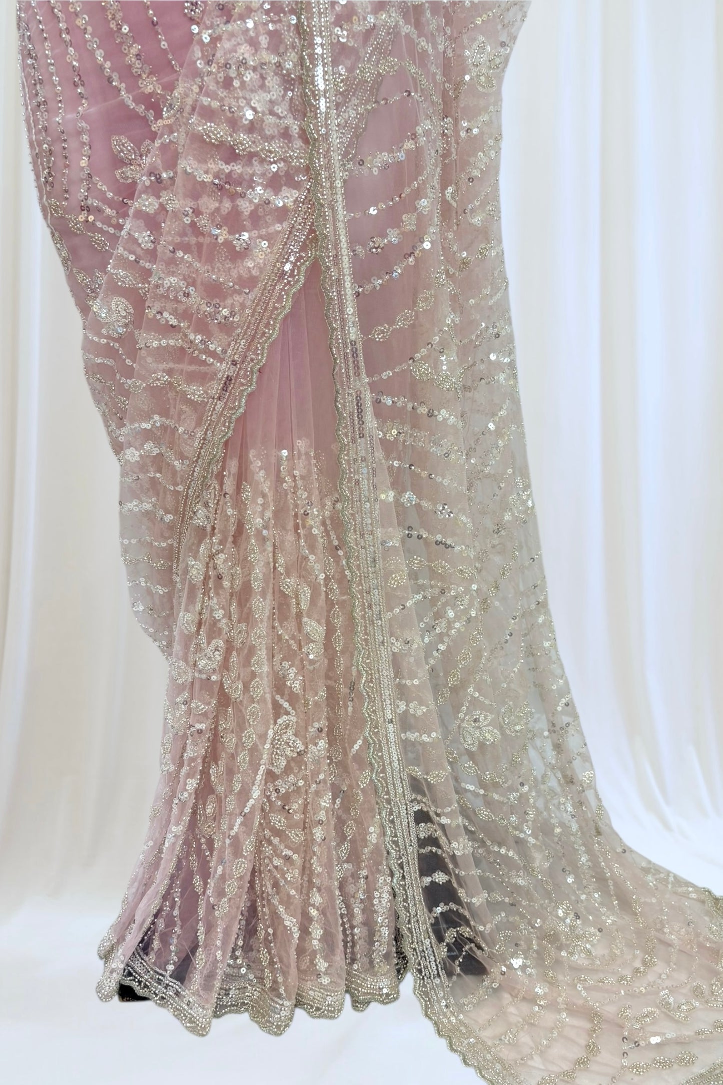 Pink sequins embellished net saree