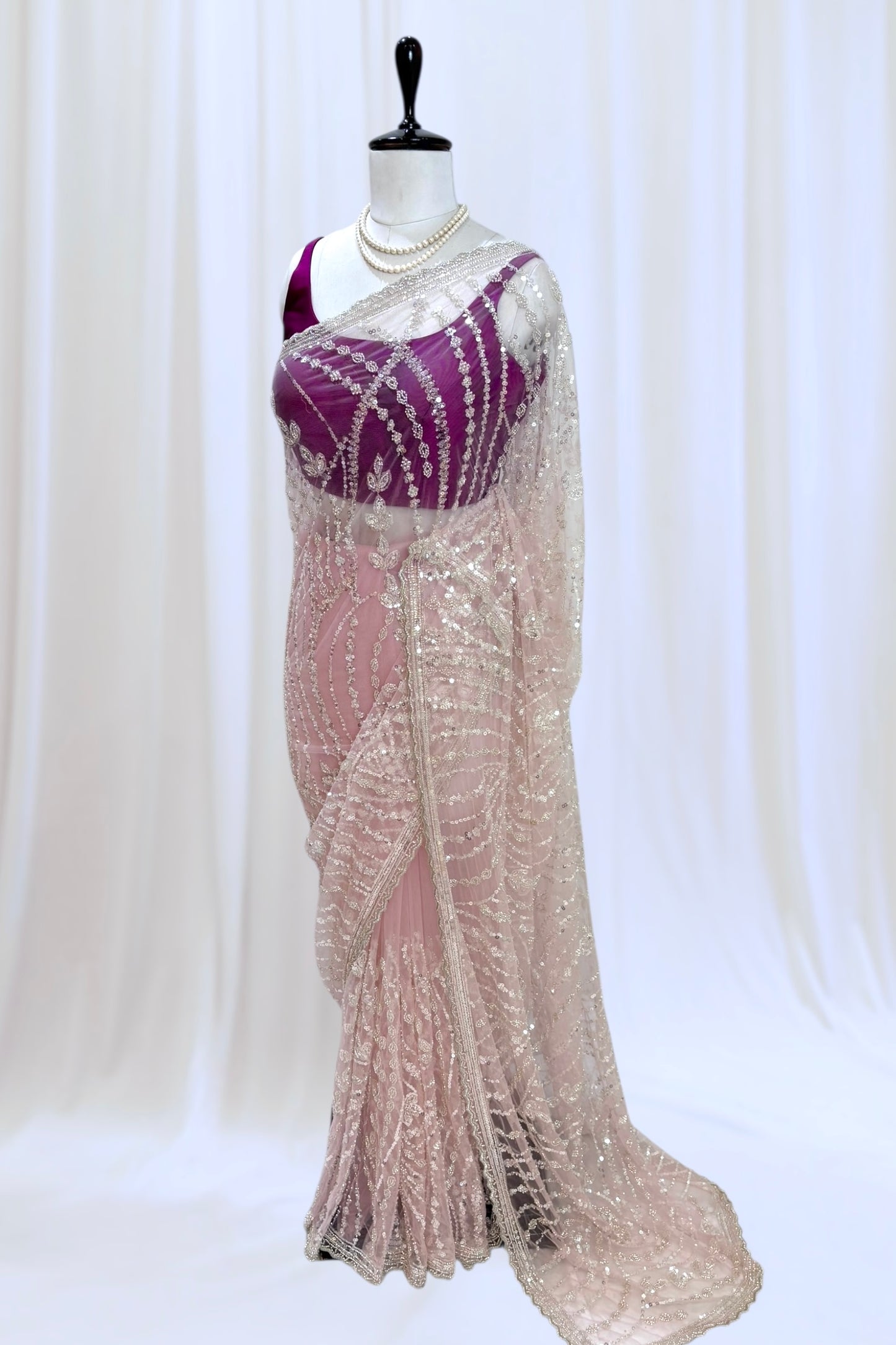 Pink sequins embellished net saree