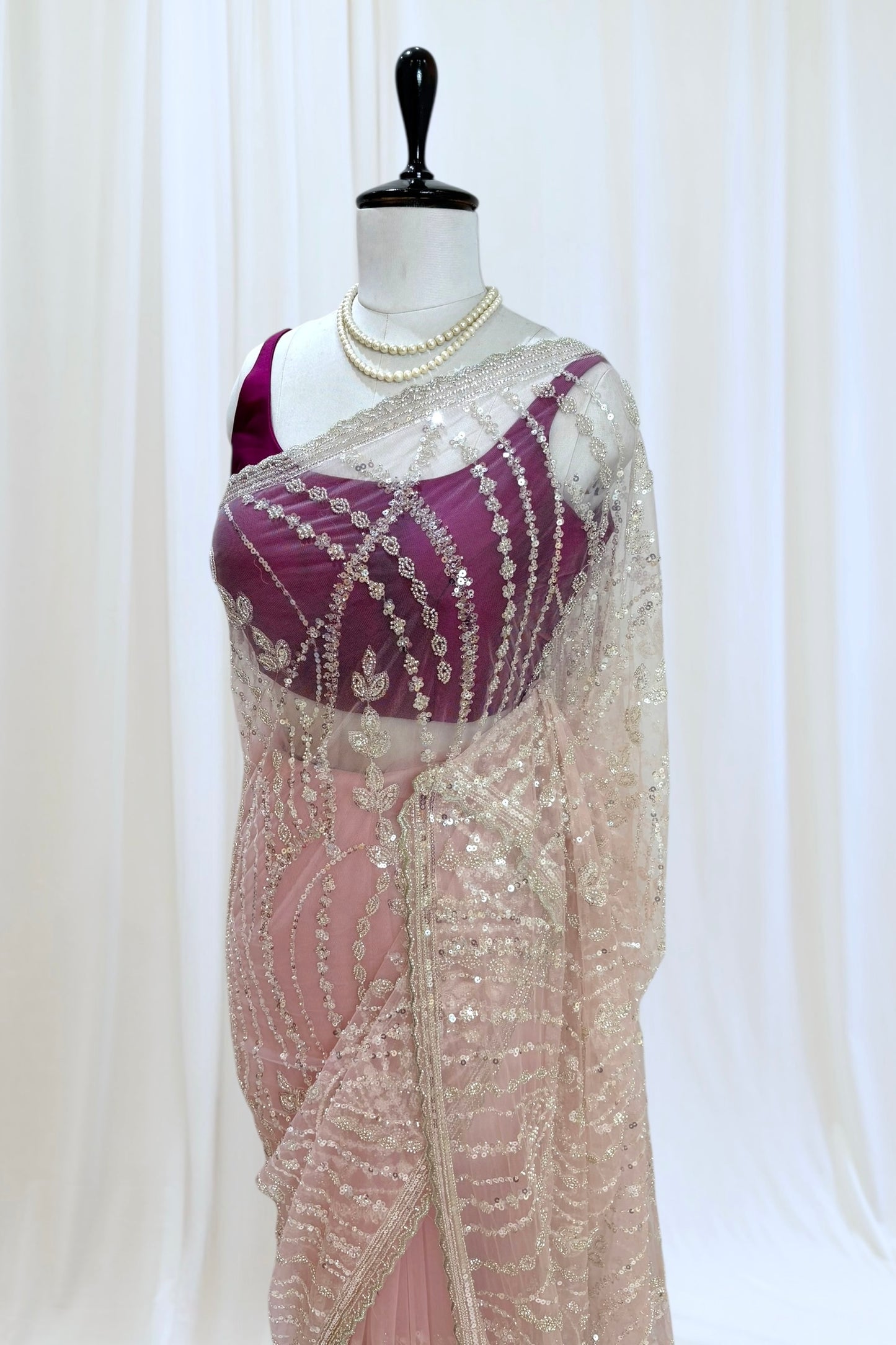 Pink sequins embellished net saree