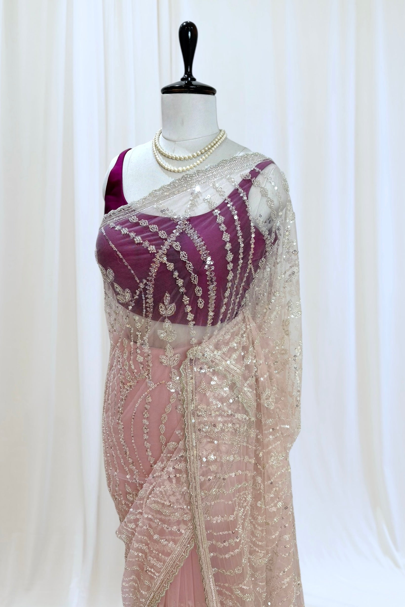 Pink sequins embellished net saree