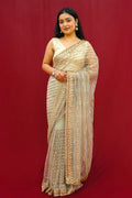Golden sequins soft net saree - Striped
