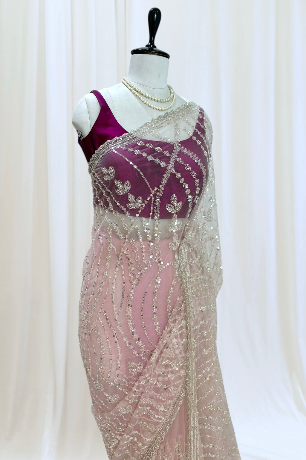 Pink sequins embellished net saree