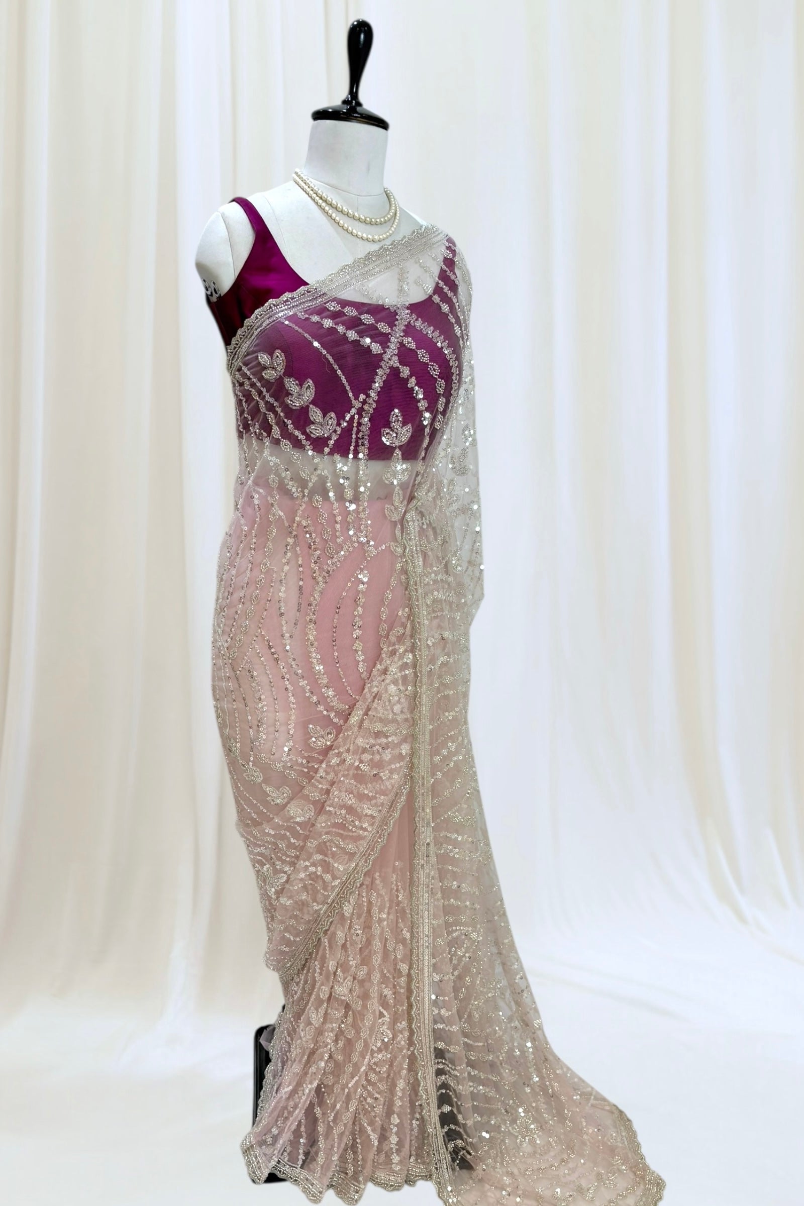 Pink sequins embellished net saree