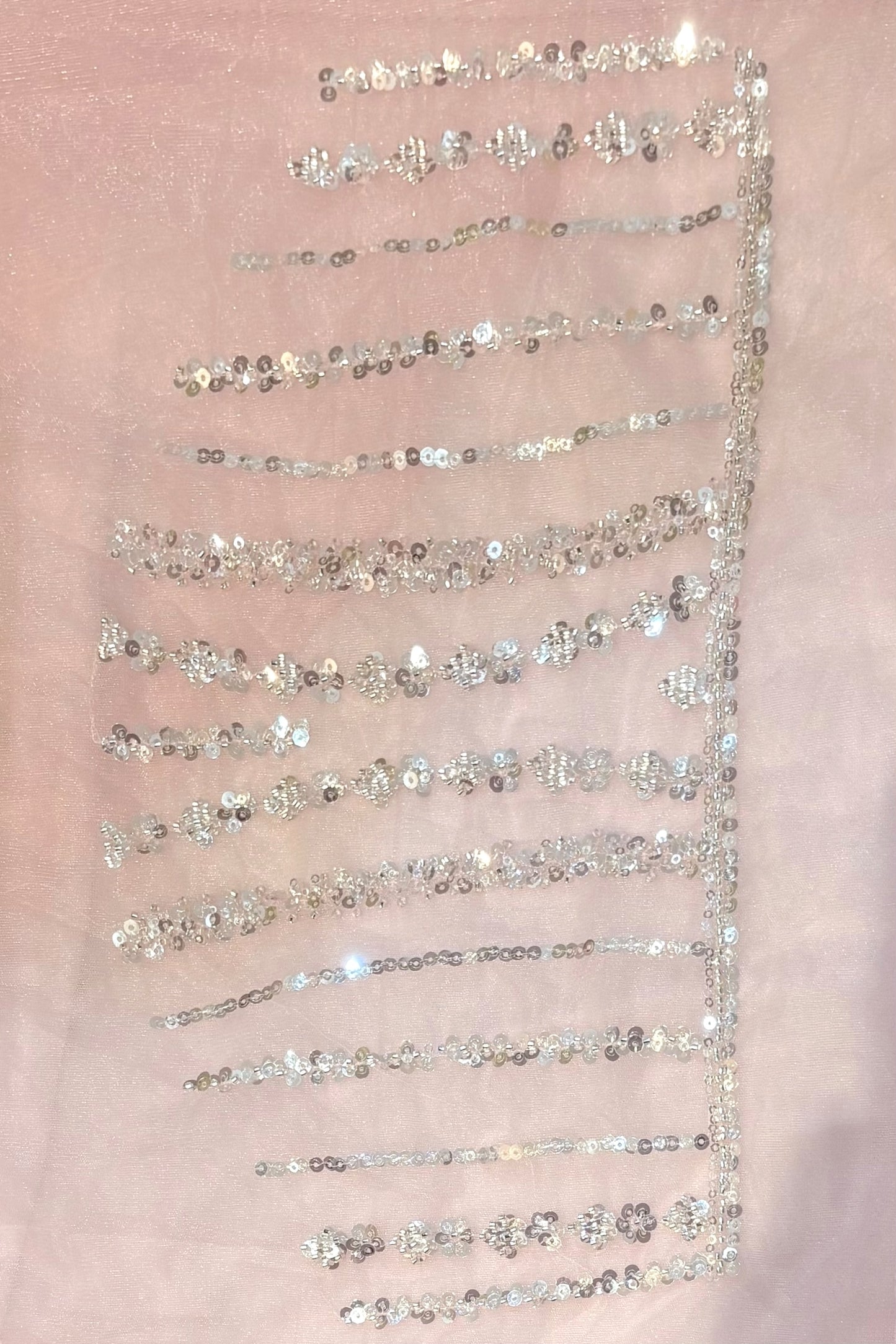 Pink sequins embellished net saree