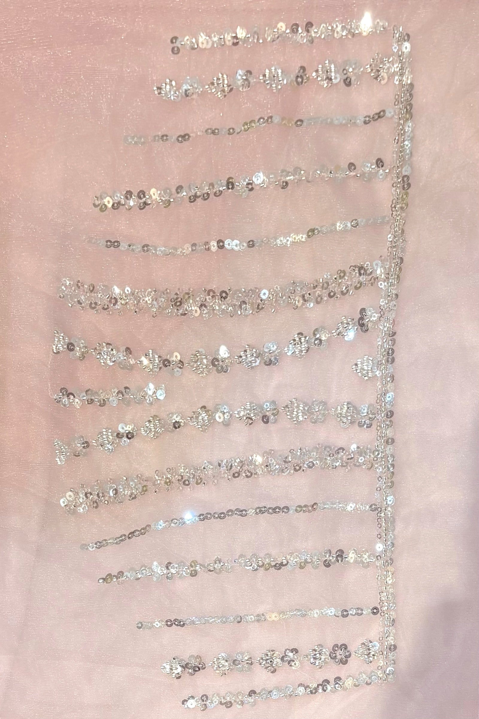 Pink sequins embellished net saree