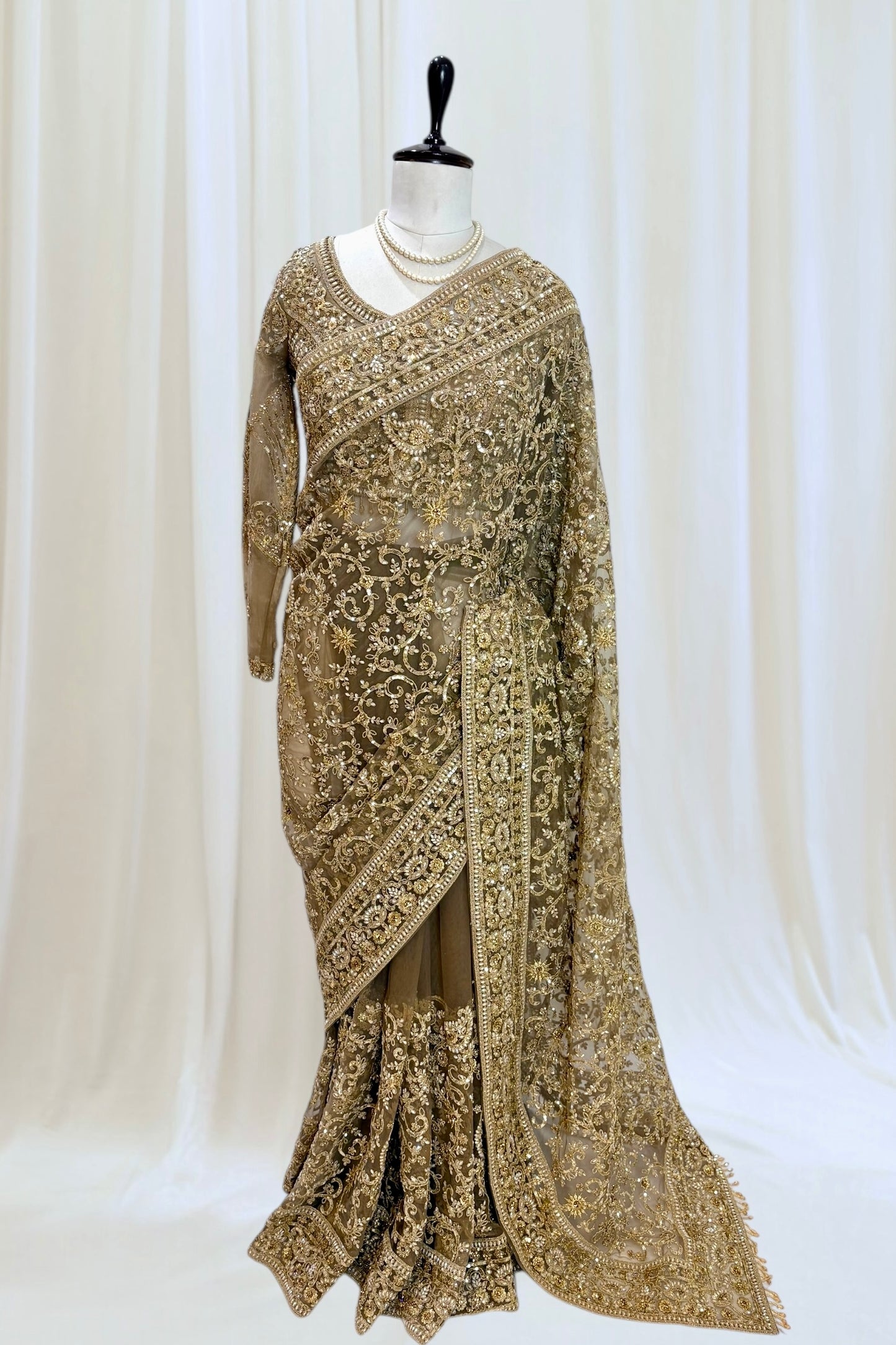 Golden embellished net saree