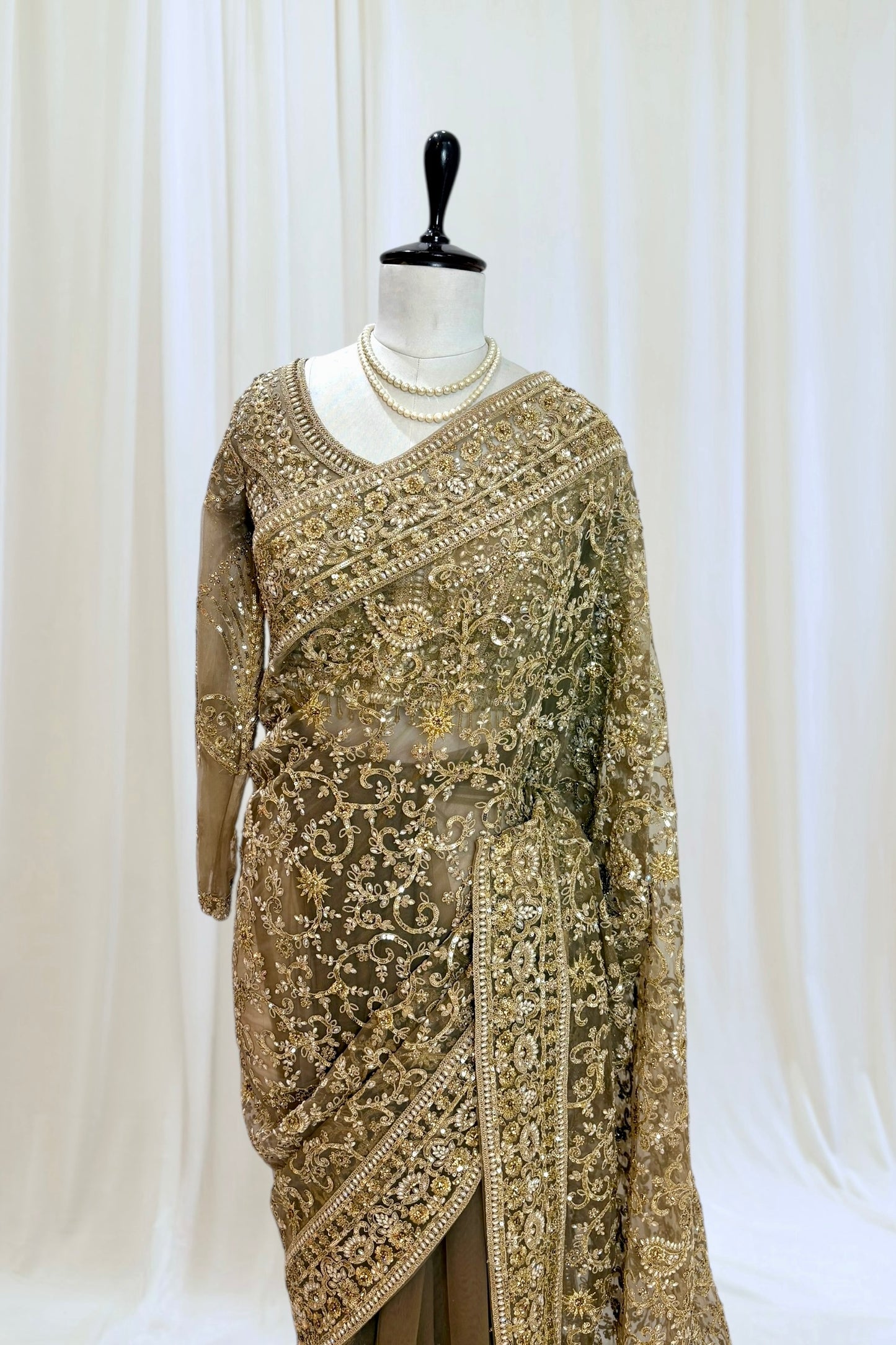 Golden embellished net saree