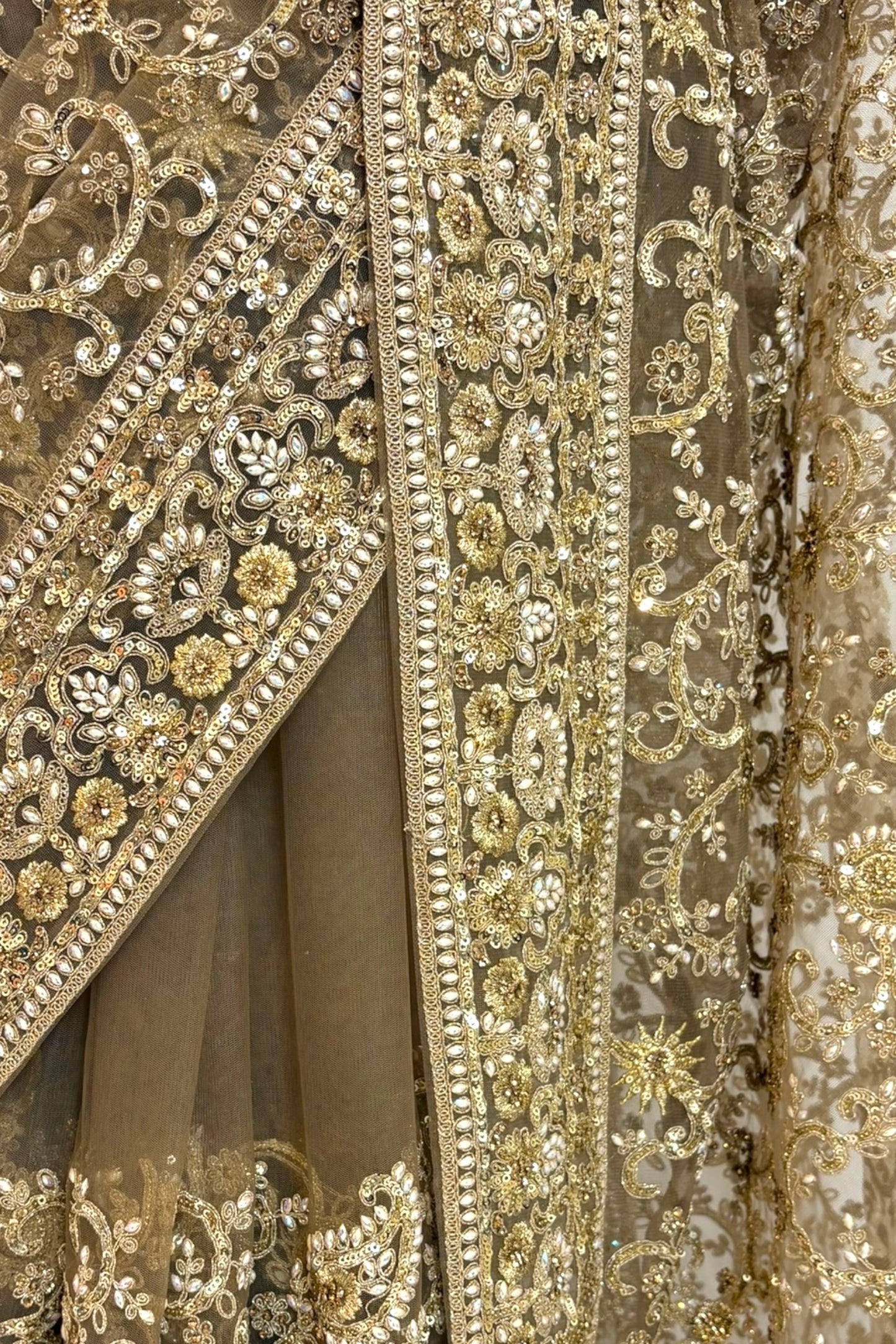 Golden embellished net saree