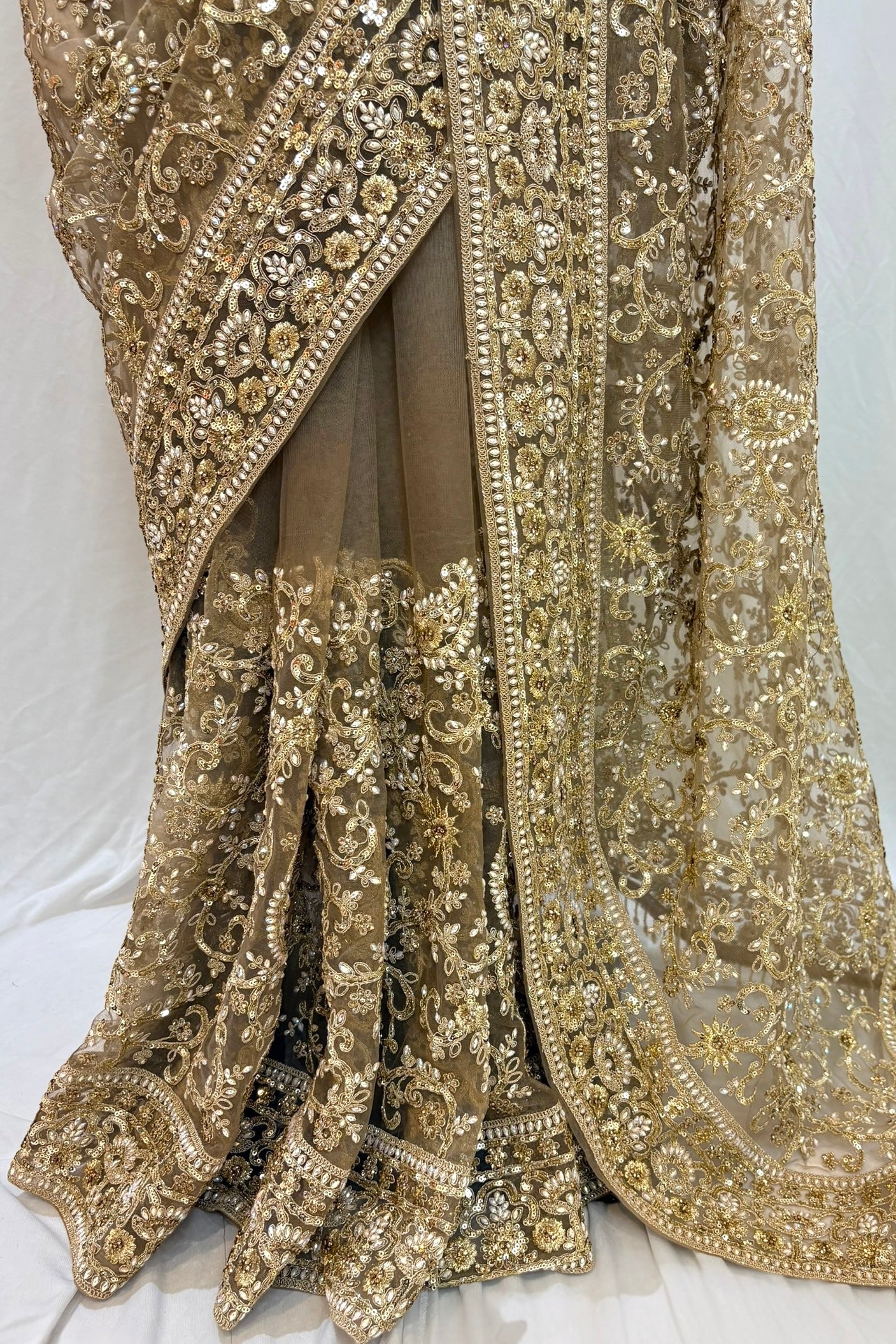 Golden embellished net saree