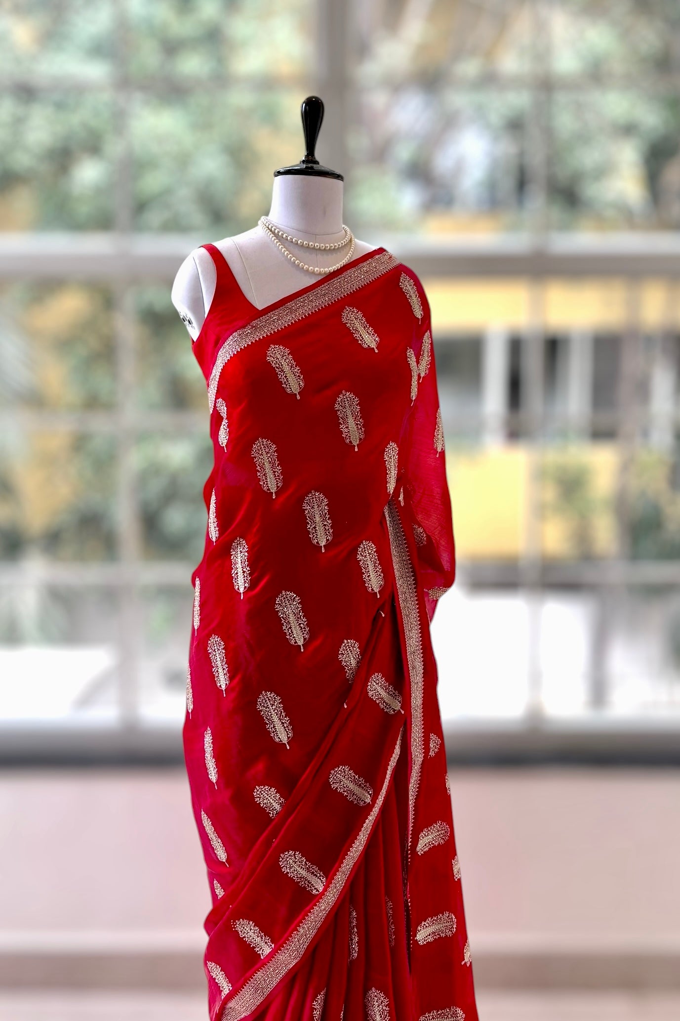 Red embroidered chiffon saree