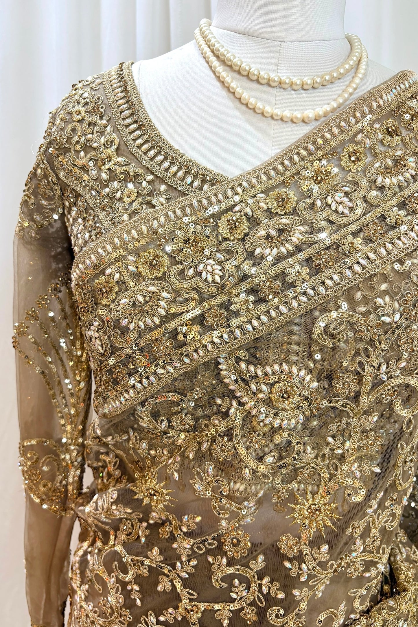 Golden embellished net saree