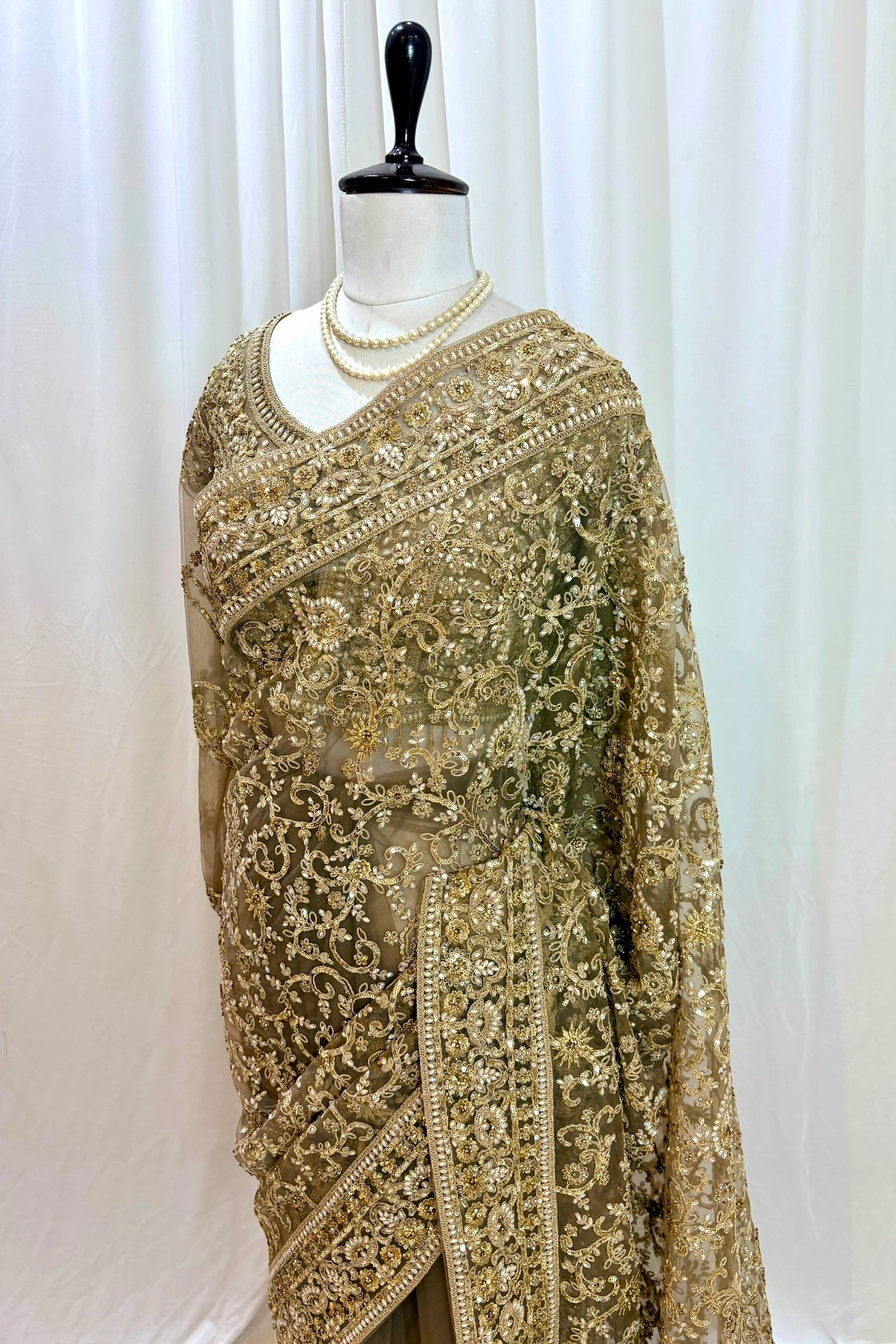 Golden embellished net saree