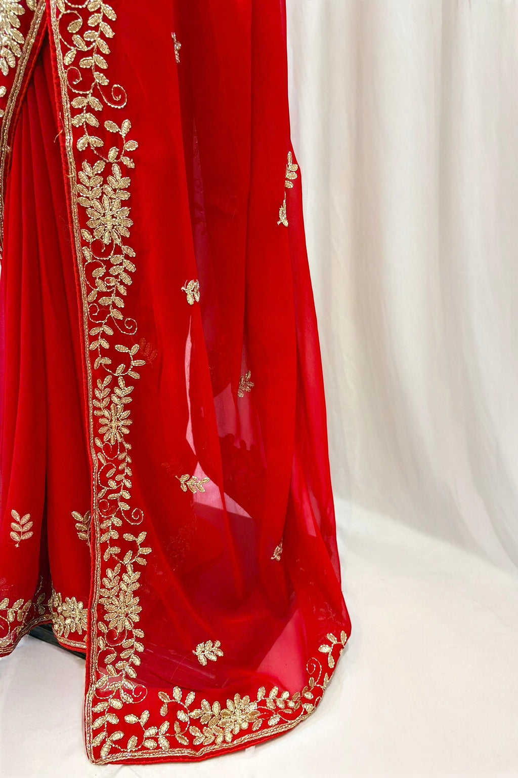 Red georgette zari embellished saree