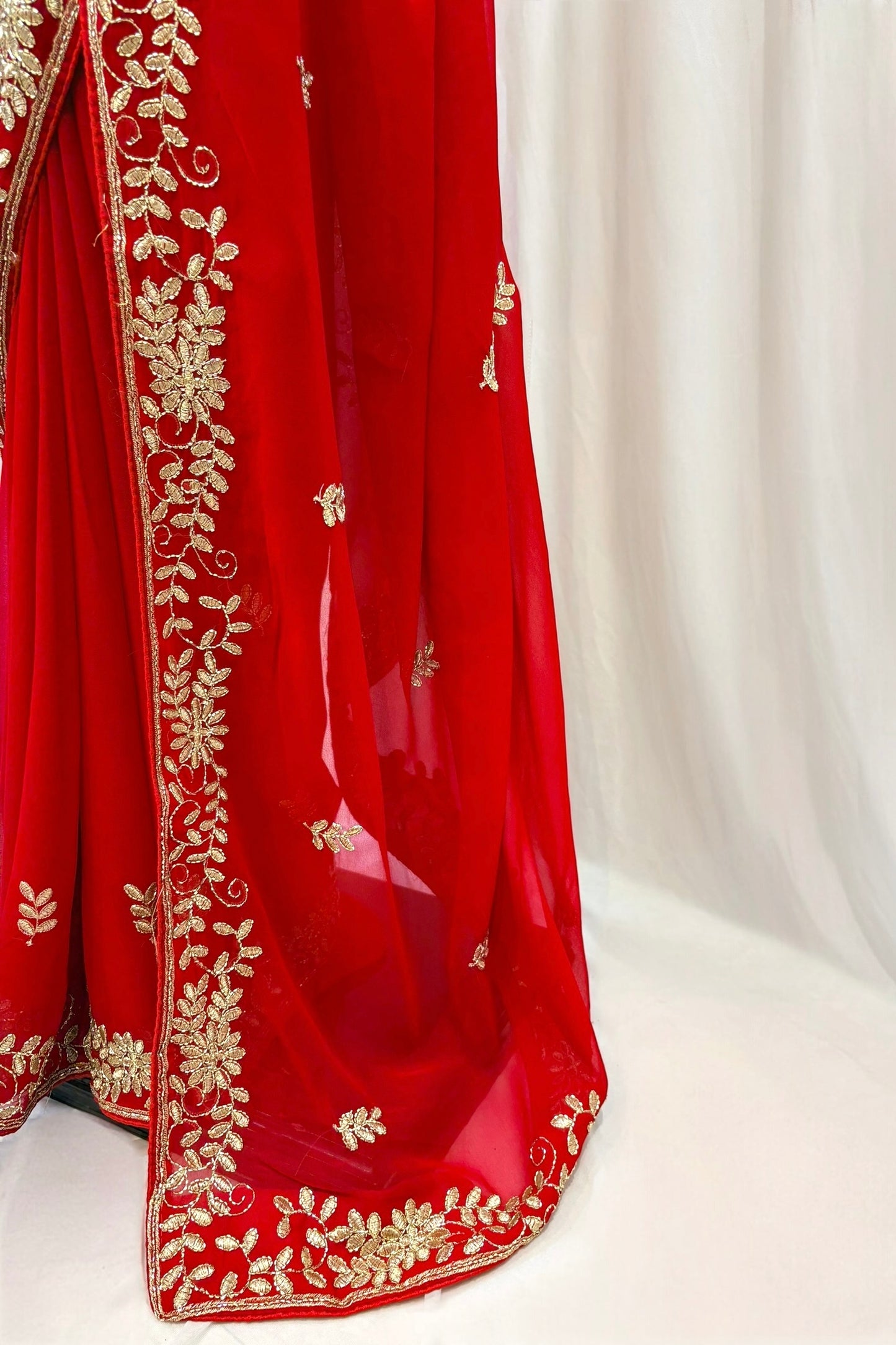 Red georgette zari embellished saree