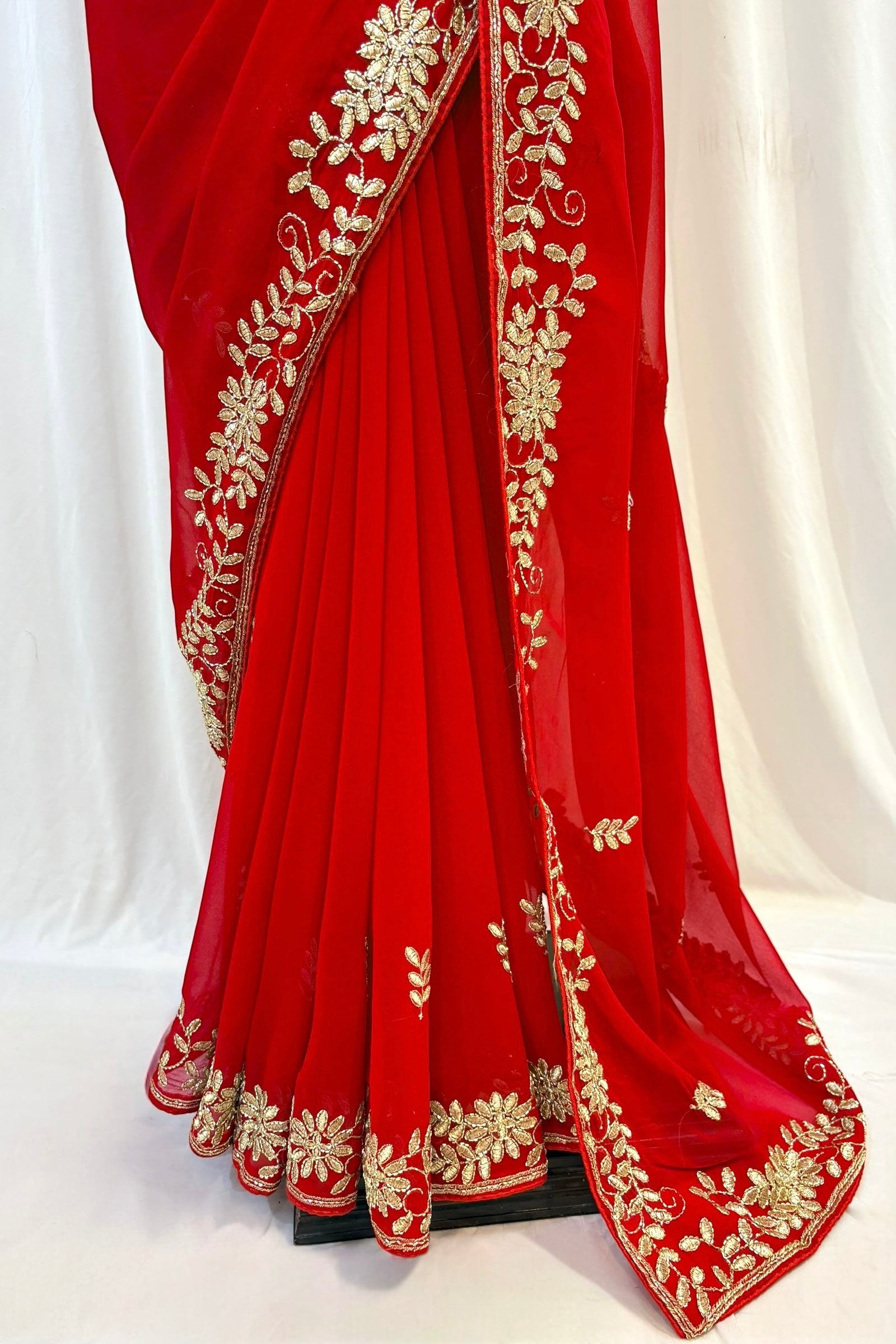 Red georgette zari embellished saree