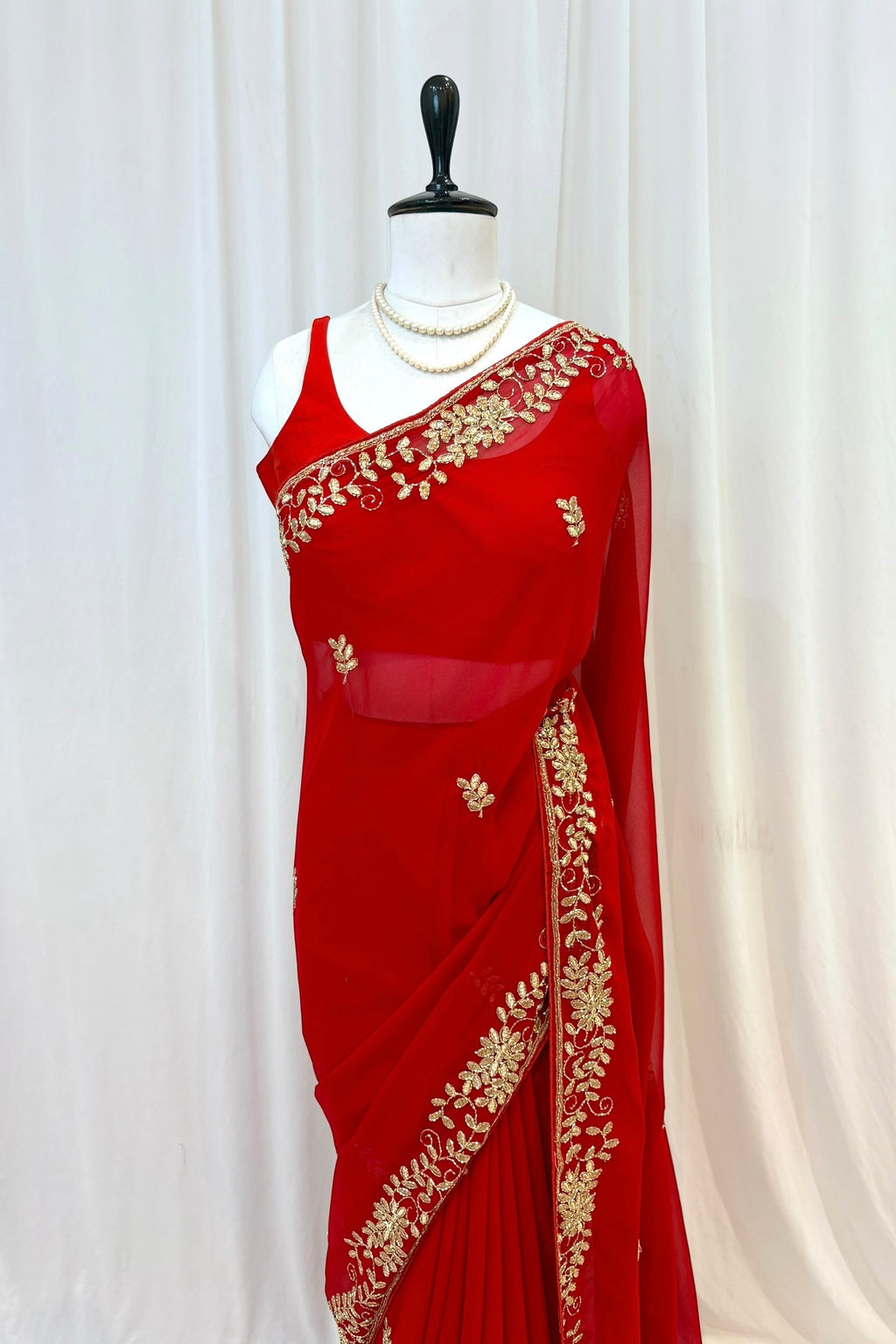Red georgette zari embellished saree