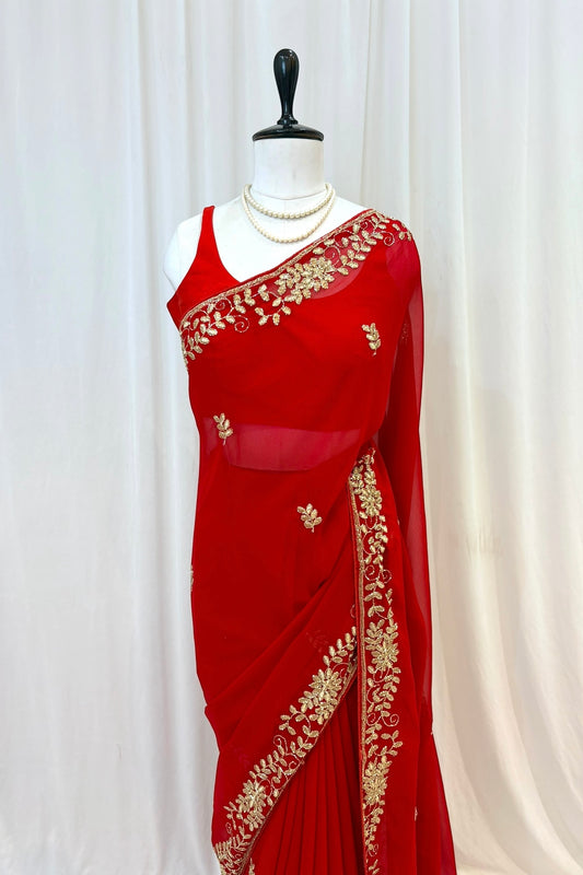 Red georgette zari embellished saree